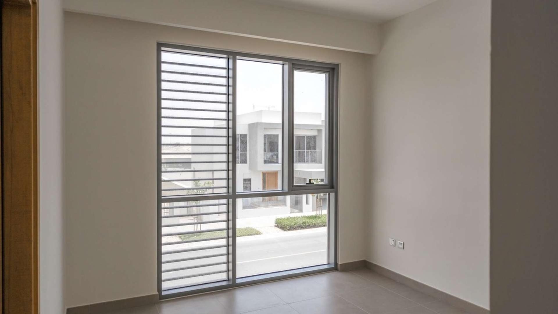 Interior view of bright room with large window in Sidra 2 villa, Dubai Hills Estate