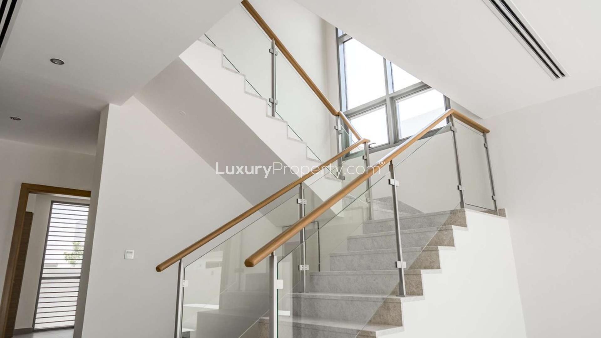 Modern kitchen and staircase in 4-bedroom Sidra Villa, Dubai Hills Estate