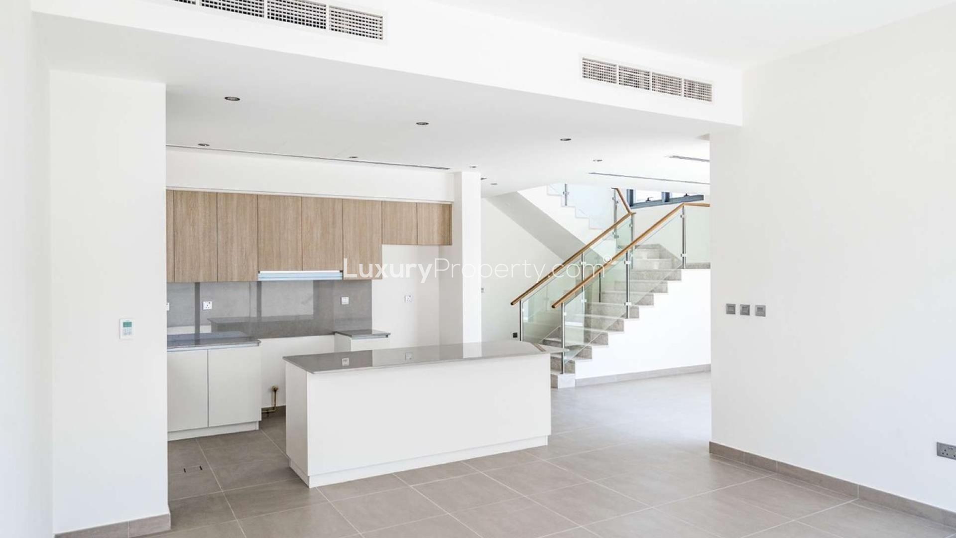 Modern kitchen and staircase in 3-bedroom villa, Sidra 2, Dubai Hills Estate