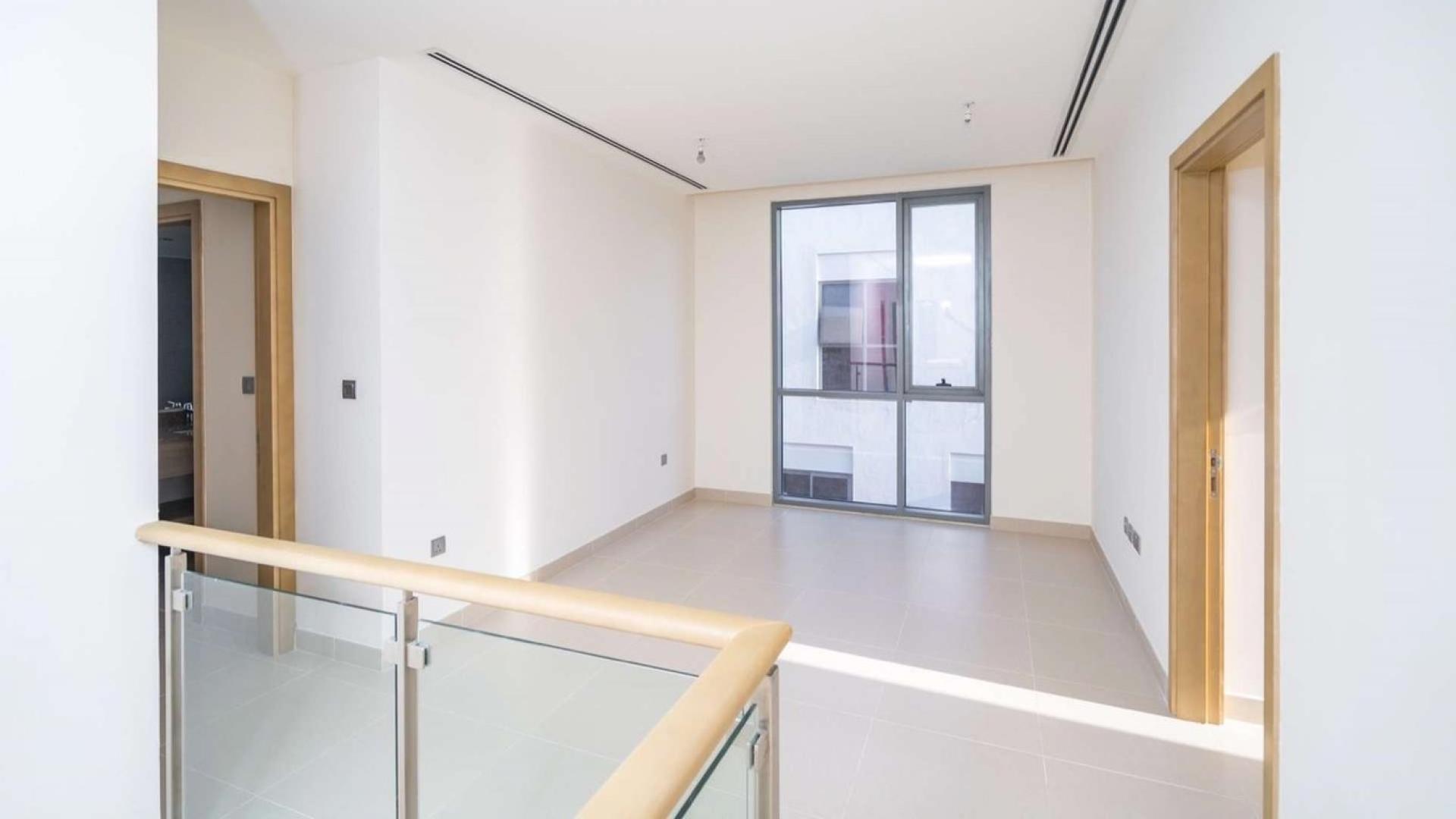 Bright bedroom in 4-bedroom villa, Sidra 2, Dubai Hills Estate, with large windows and decor