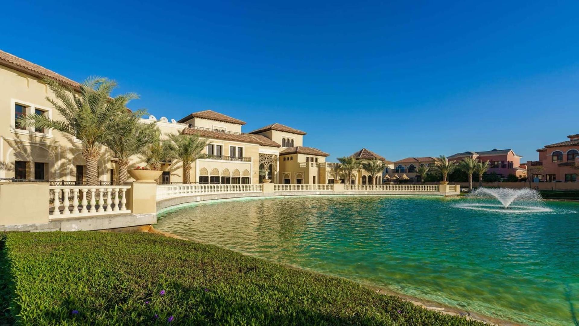 Four-bedroom villa exterior with lake view in Orange Lake, Jumeirah Golf Estates
