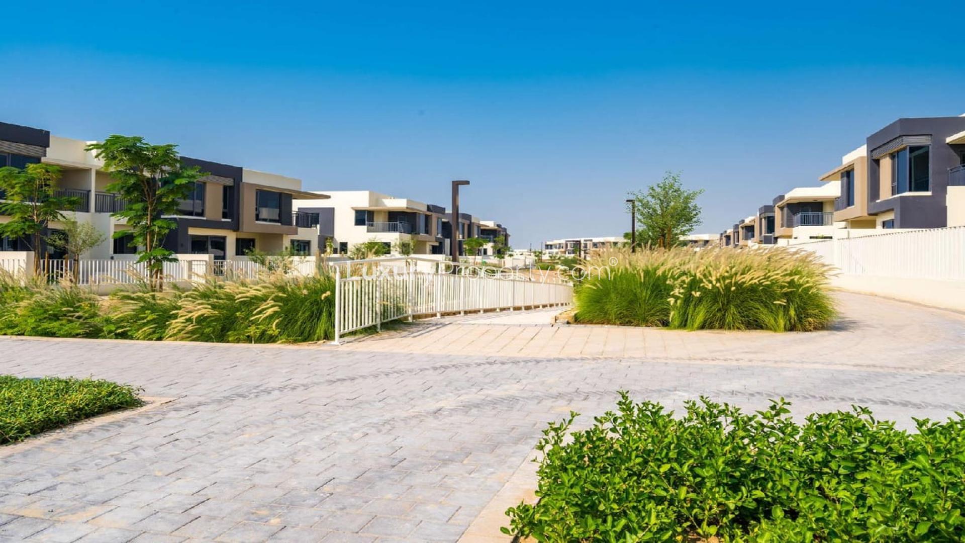 Three-bedroom villa exterior at Maple, Dubai Hills Estate, with modern design and lush lawn