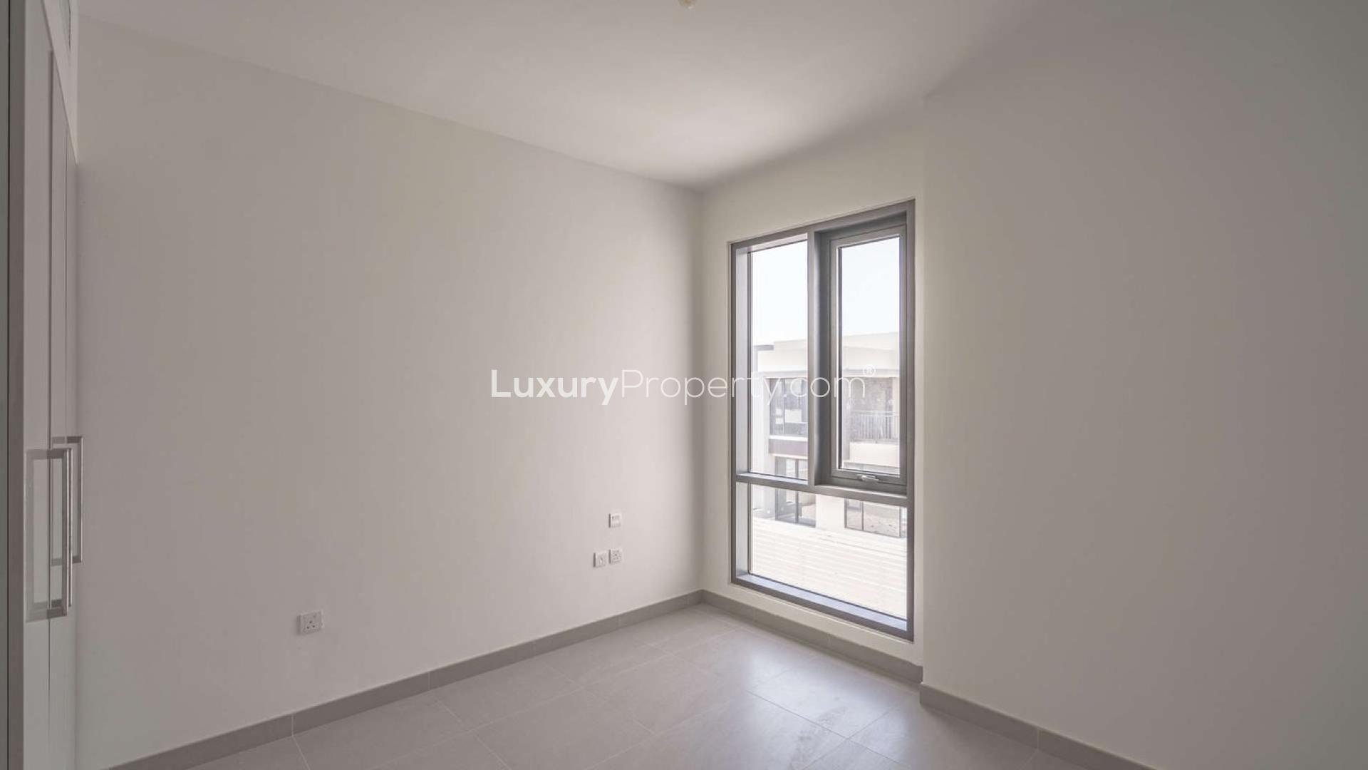 Modern kitchen and living area in four-bedroom townhouse, Maple at Dubai Hills Estate