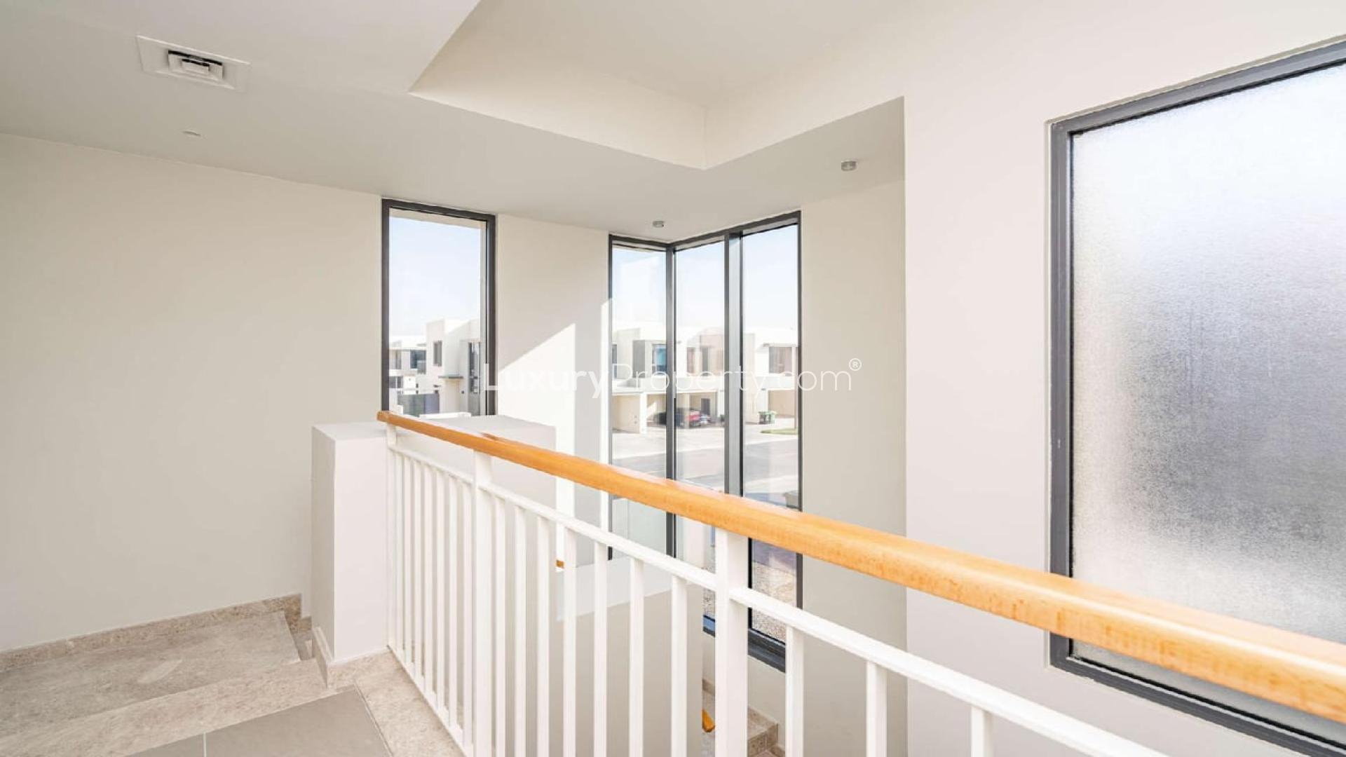 Bright living room with large windows in Dubai Hills Estate townhouse, Maple community