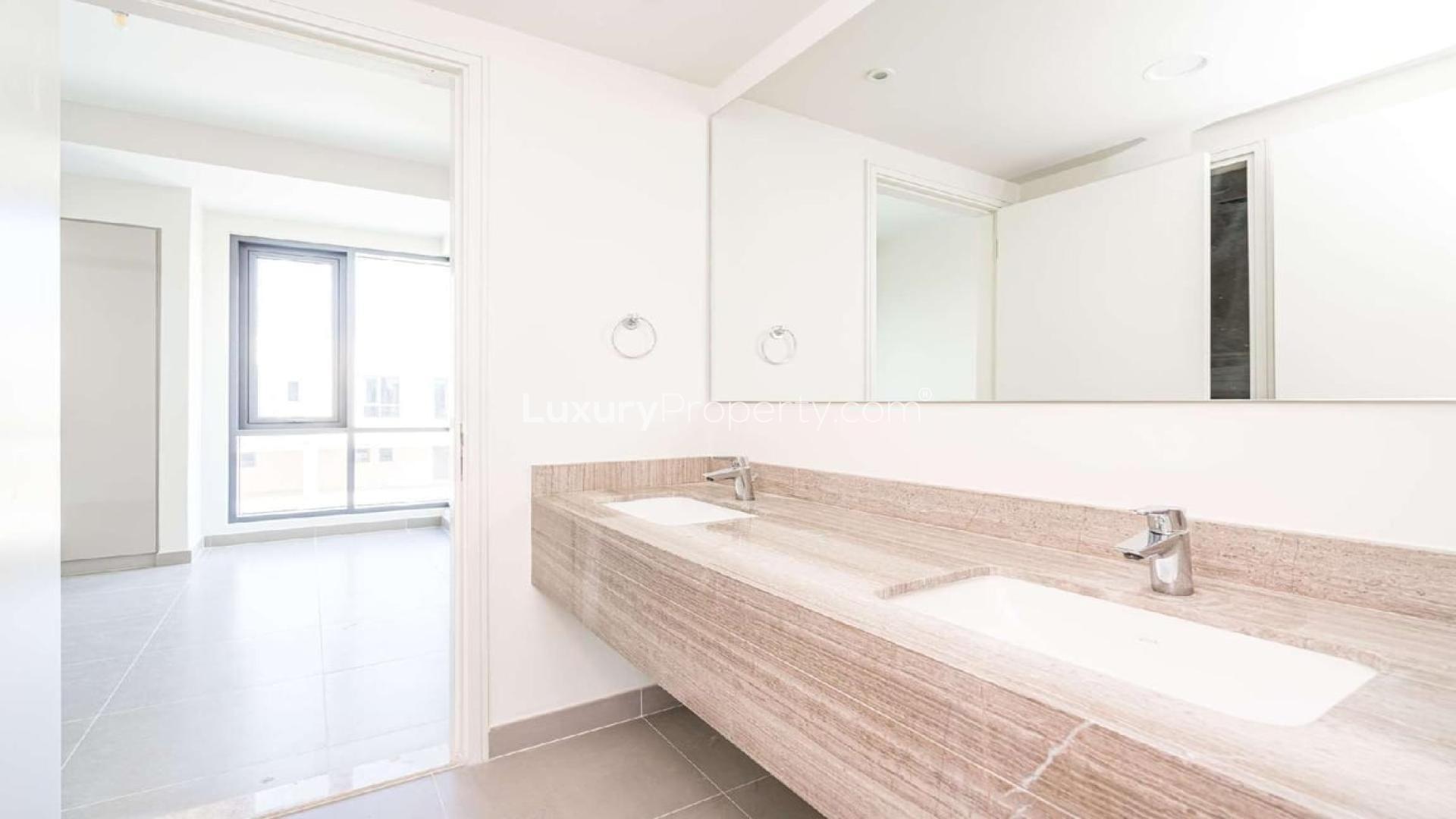 Bright living area in Maple Villa, Dubai Hills Estate, with large windows and garden view