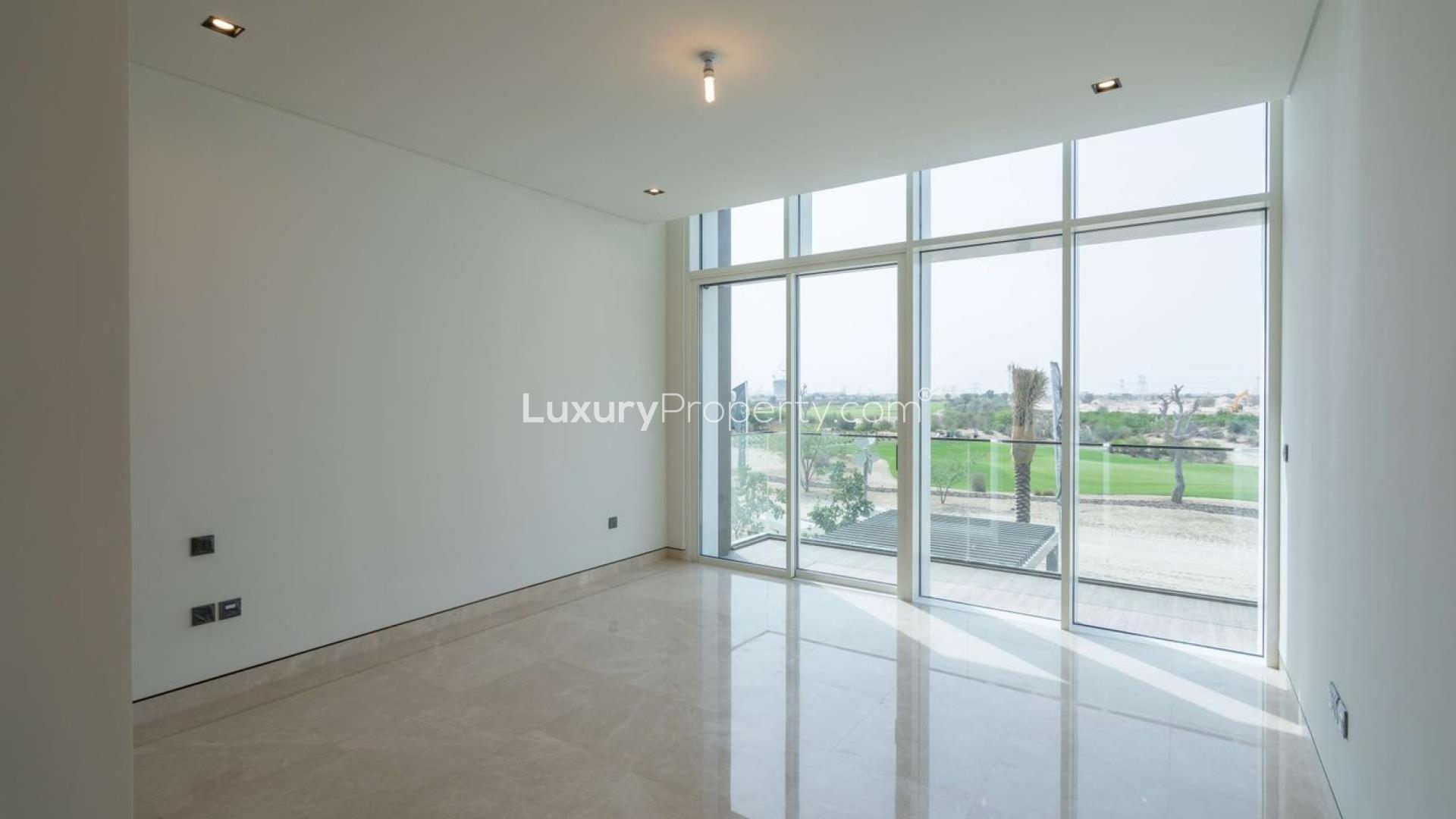 Spacious living area with floor-to-ceiling windows in Golf Place villa, Dubai Hills Estate