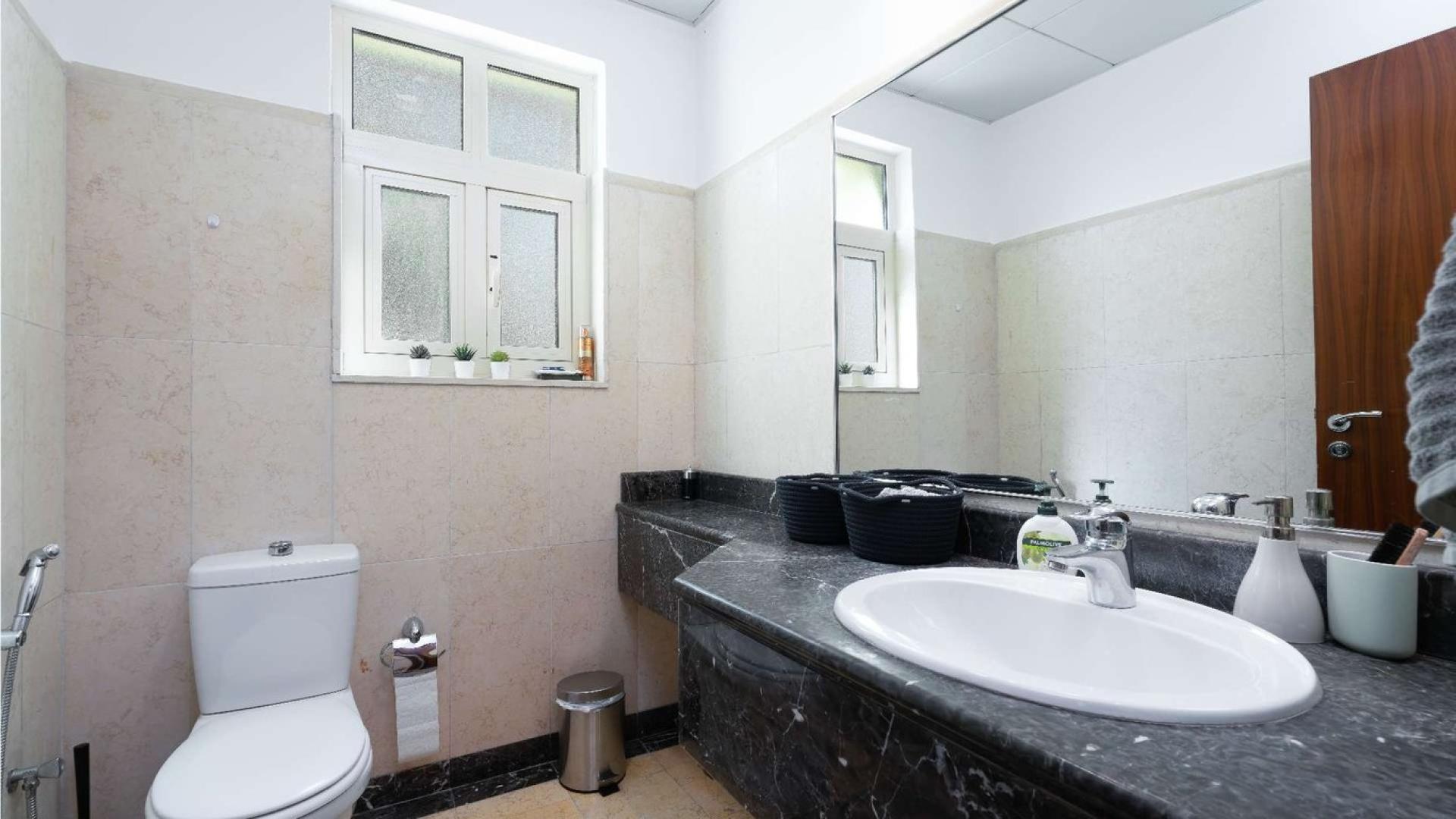 Spanish-style villa with lake view, bridge, and skyline in Jumeirah Islands, European Clusters