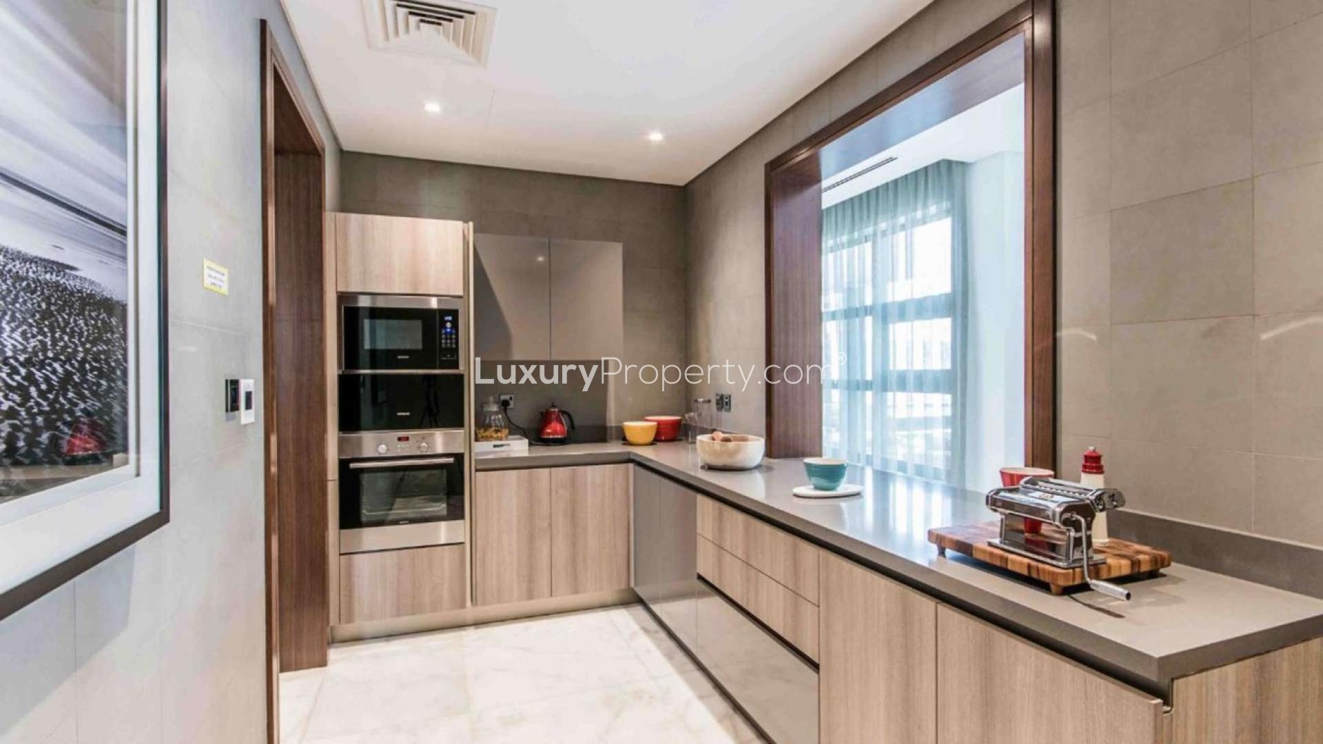 Luxurious living room in contemporary villa, Sobha Hartland, with large windows and modern decor