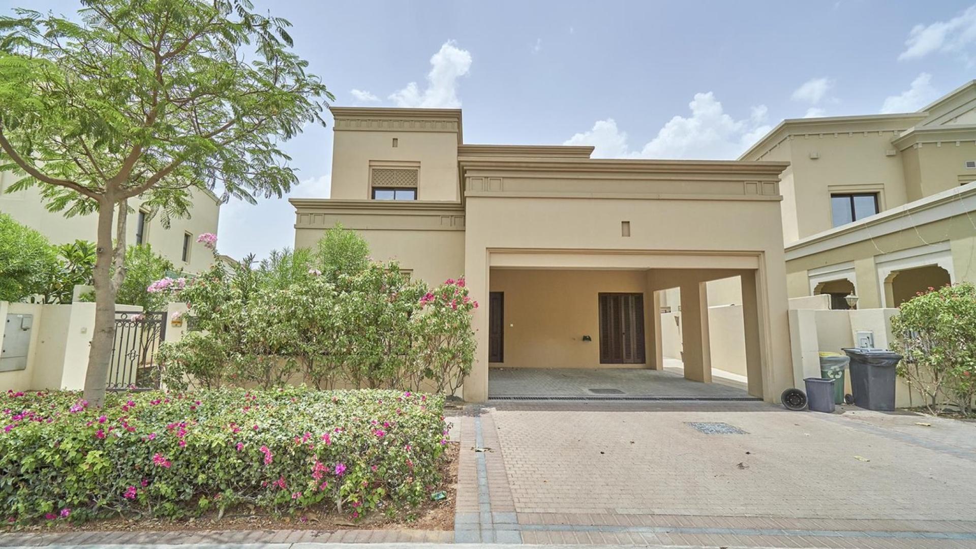 Single row villa exterior in Casa, Arabian Ranches 2, with lush garden space, for sale