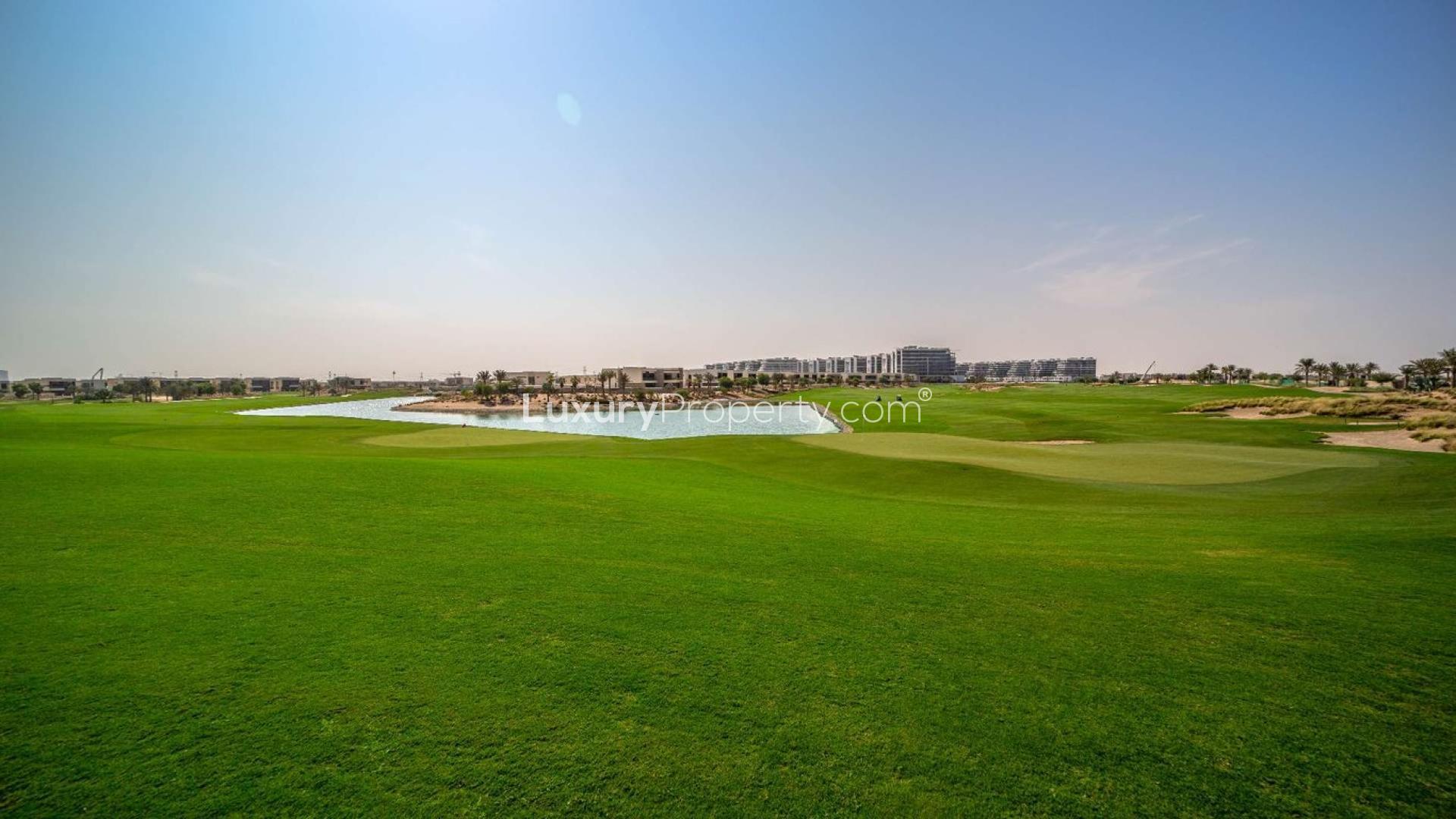 Luxurious bedroom in four-bedroom villa, The Legends, Damac Hills with balcony view