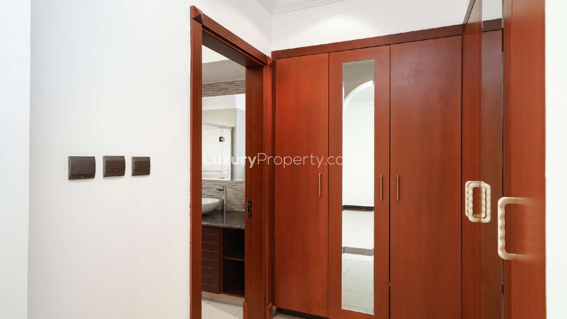 4-bedroom villa exterior in Orange Lake, Jumeirah Golf Estates, with elegant architecture and lake views