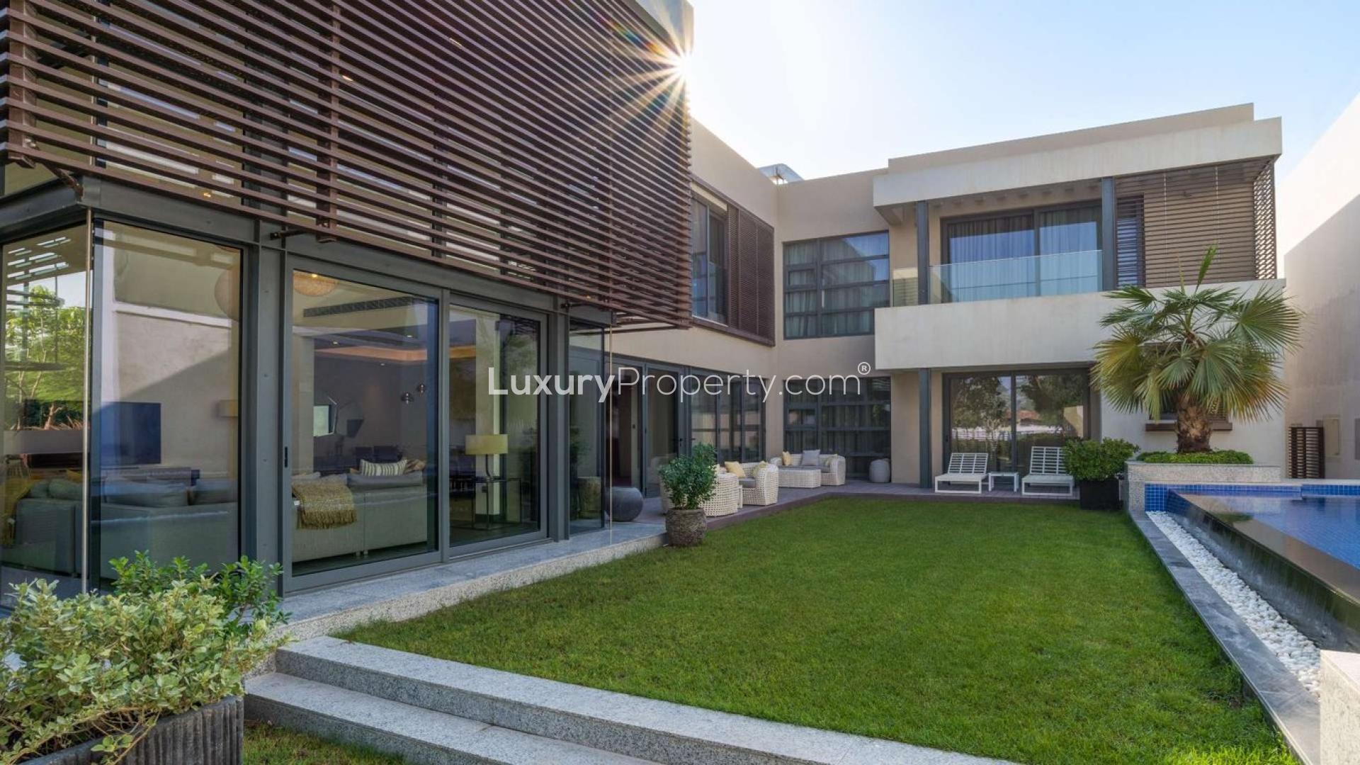 Luxurious living room in Sobha Hartland villa, featuring elegant decor and large windows