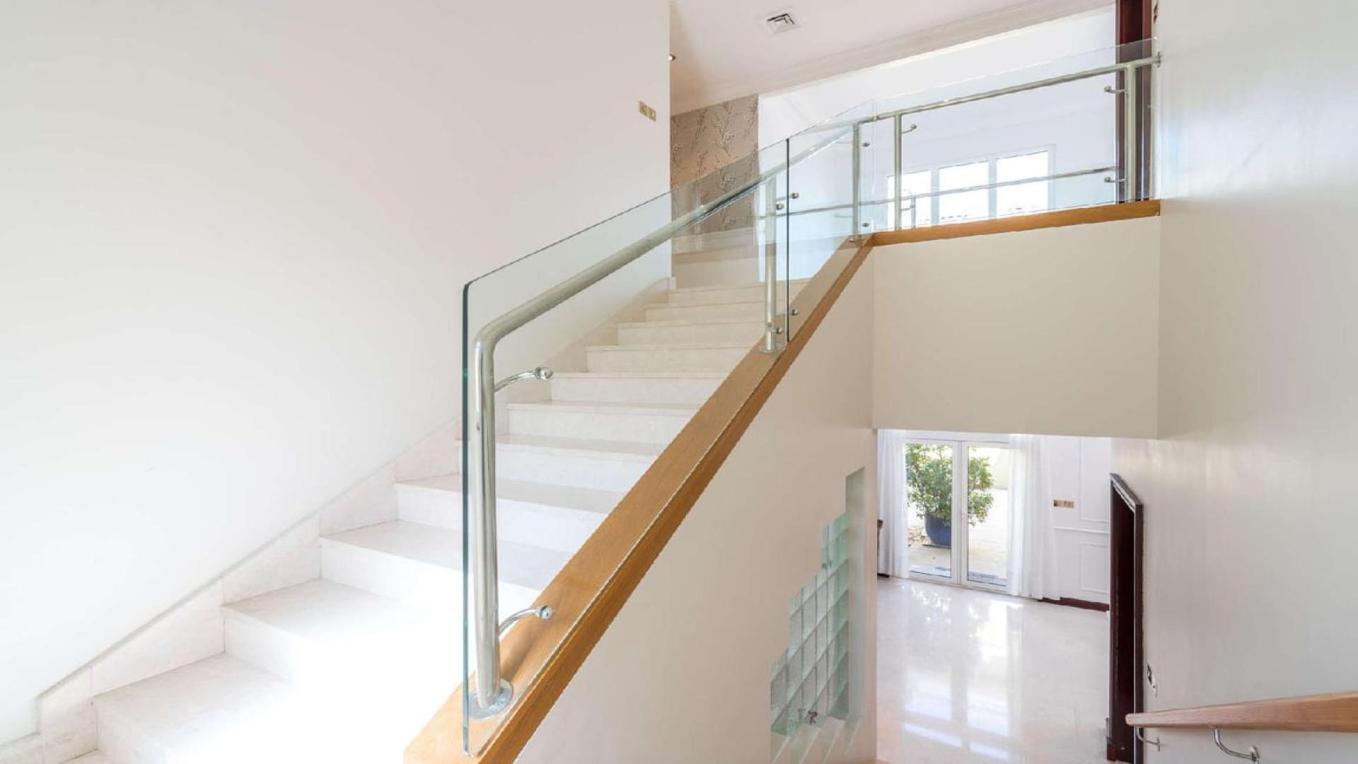 Upgraded 4-bedroom villa exterior with palm trees, private pool, Palm Jumeirah, for sale