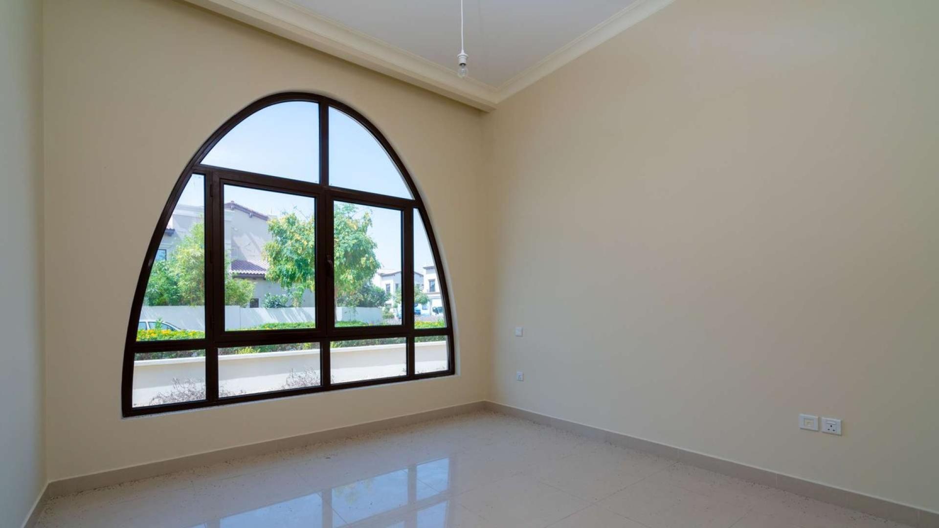 Bright room with large arched window in 4-bedroom villa, Rosa, Arabian Ranches 2