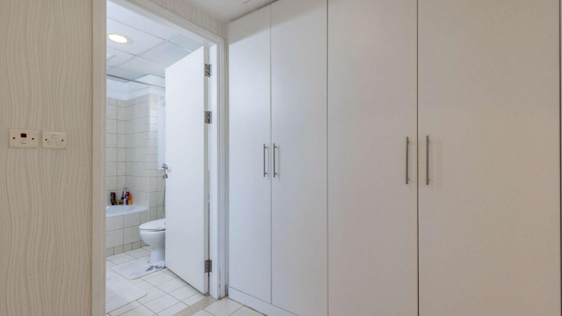 Villa with spacious backyard in Meadows 9, featuring outdoor seating and dining area