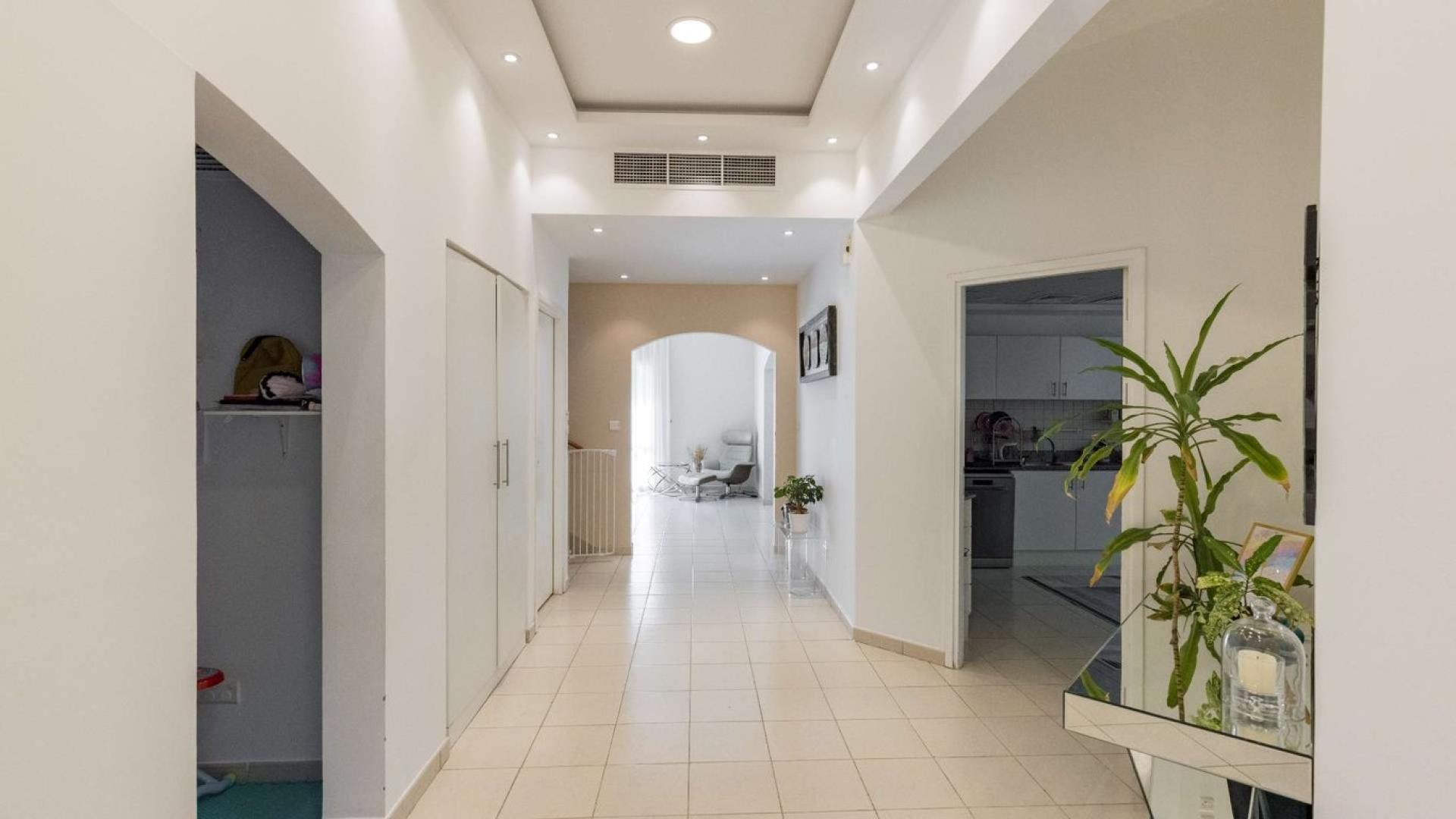 Luxurious living room in Meadows 9 villa with modern decor and natural light