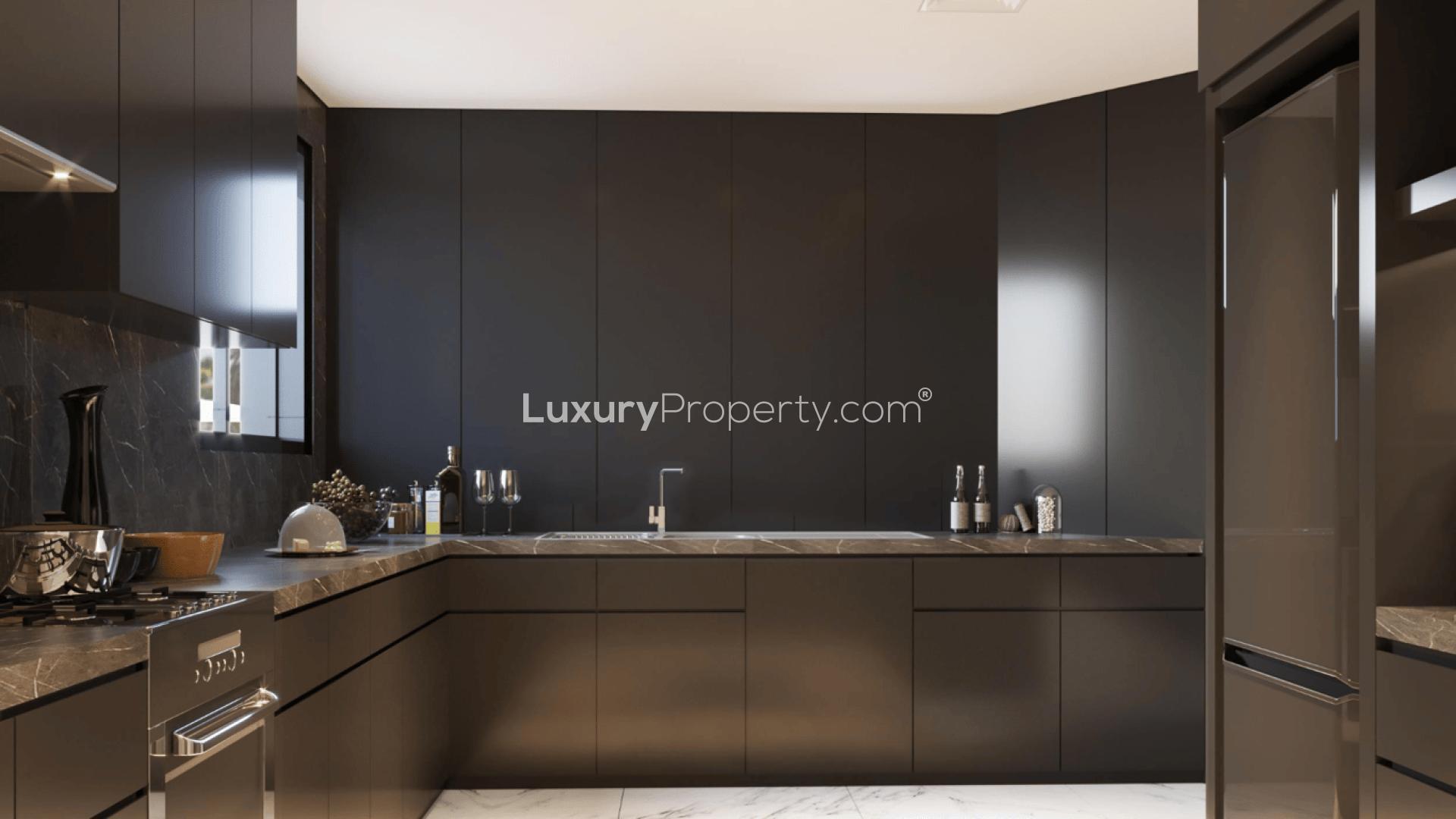 "Elegant 4-bedroom villa with pool and palm trees on Palm Jumeirah, Garden Homes.",Luxurious modern kitchen in 4-bedroom villa, Palm Jumeirah Garden Homes, for sale