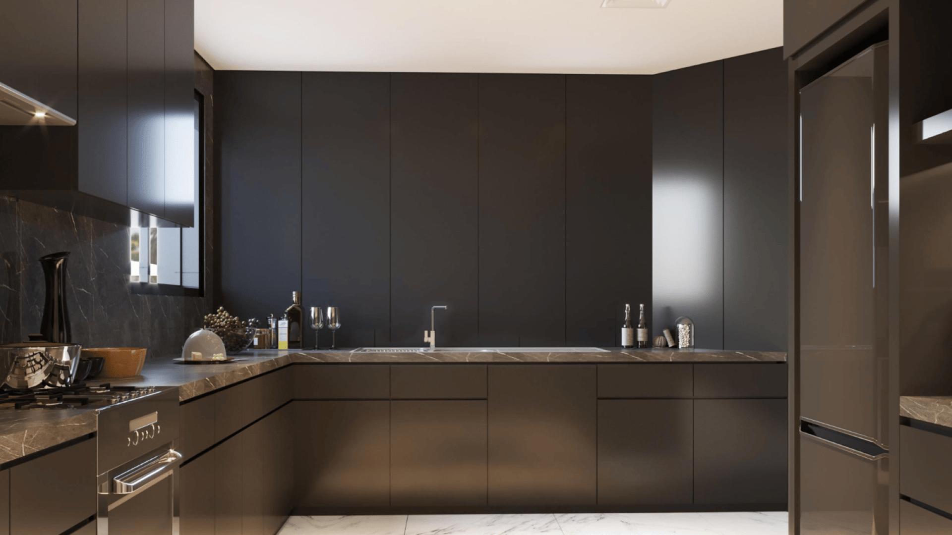 "Elegant 4-bedroom villa with pool and palm trees on Palm Jumeirah, Garden Homes.",Luxurious modern kitchen in 4-bedroom villa, Palm Jumeirah Garden Homes, for sale