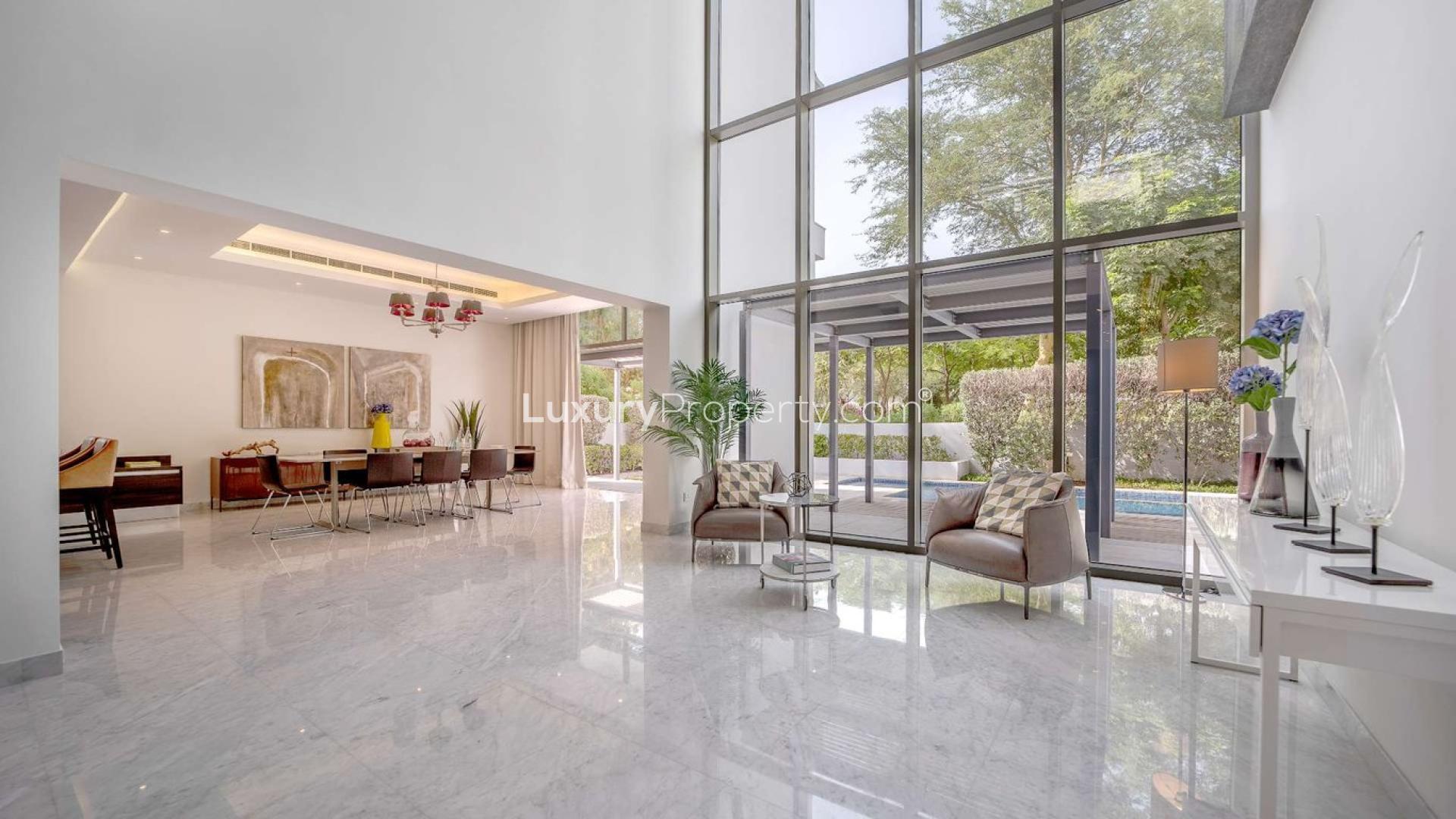 Contemporary villa interior with spacious living area and garden view in District One