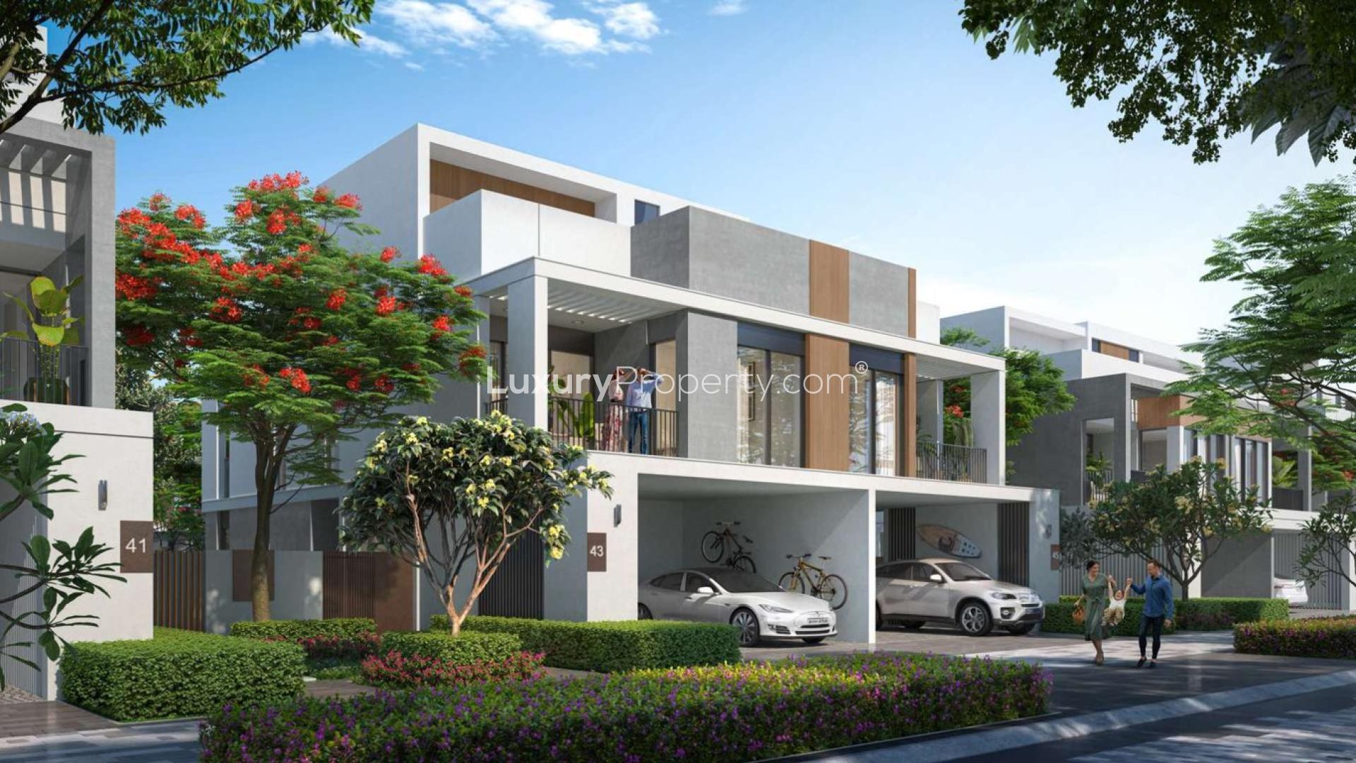 Customizable 4-bedroom twin villa exterior in Aura Gardens, Tilal Al Ghaf, lush landscaping