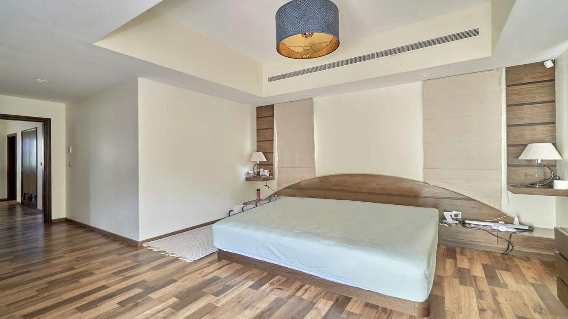 Luxurious 4-bedroom villa exterior with lush garden in Alvorada, Arabian Ranches for sale