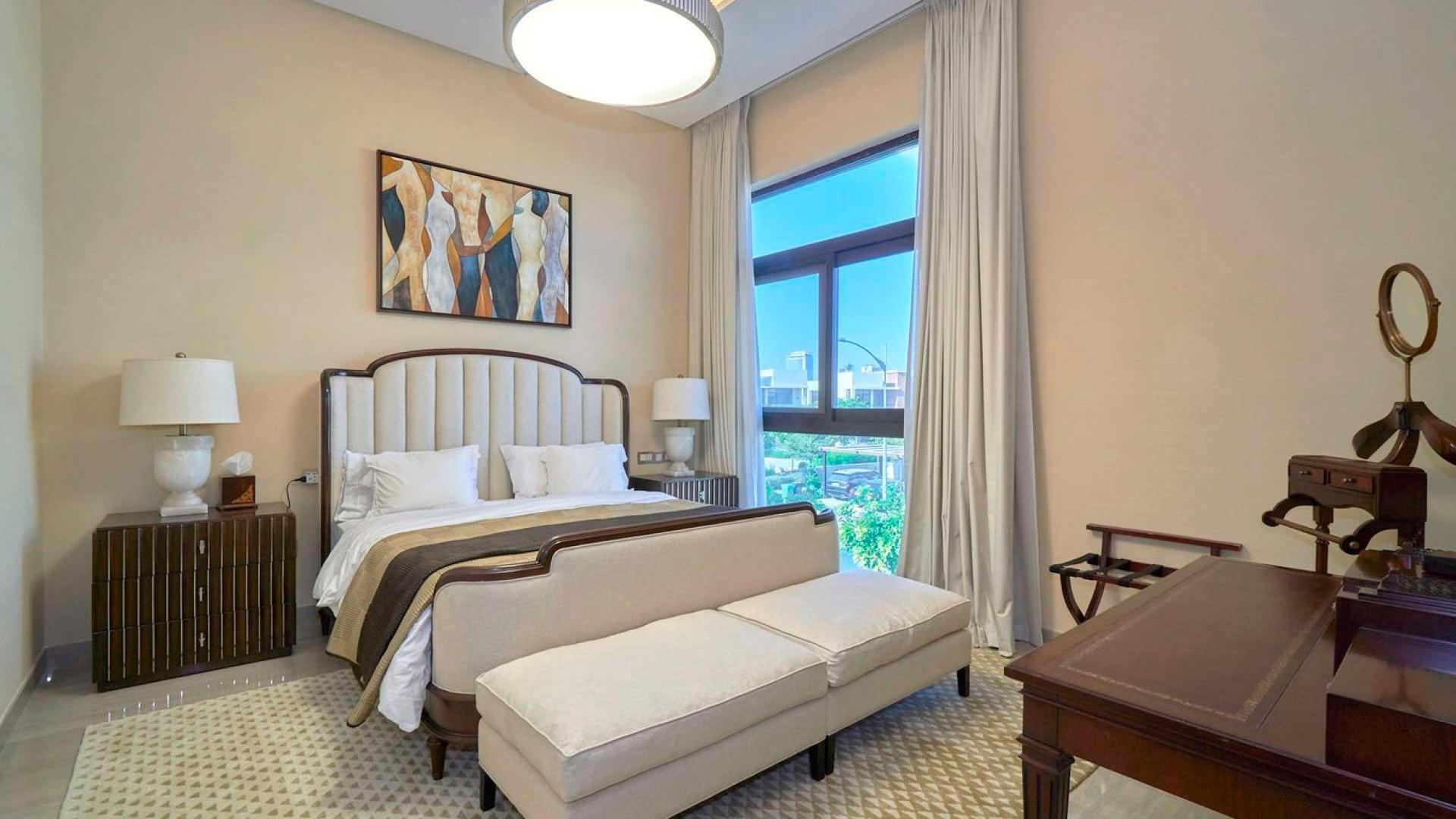 Modern upgraded villa entrance with carport in Longview, Damac Hills, for sale