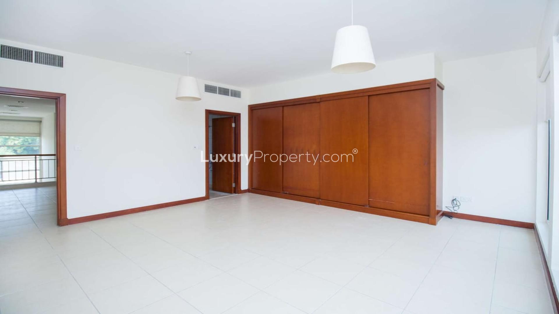 Bright, spacious living area in Saheel villa, Arabian Ranches with garden view