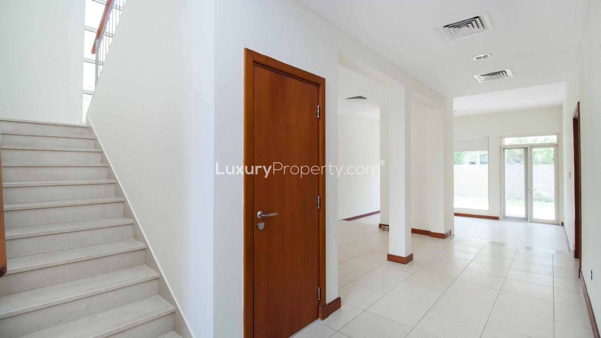 Interior of well-maintained villa in Saheel, Arabian Ranches with tiled floors and fireplace