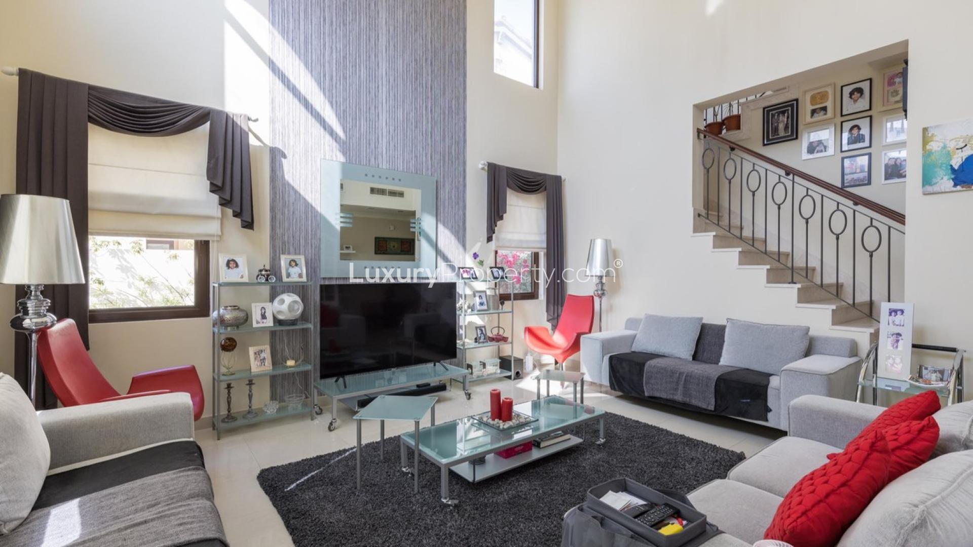 "Elegant entrance of 4-bedroom villa for sale in Rasha, Arabian Ranches 2.",Interior of Type 2 Villa in Rasha, Arabian Ranches 2, featuring modern decor and staircase