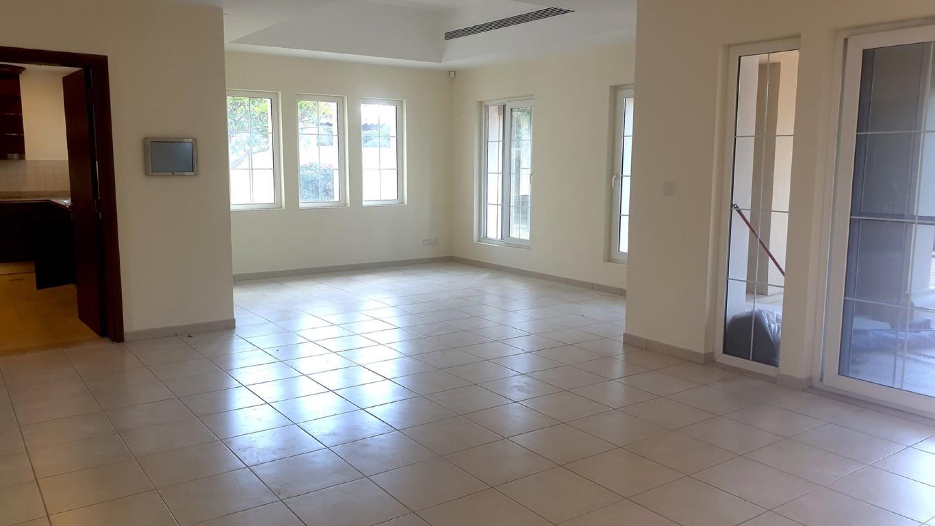 Spacious living area with large windows in Alvorada villa, Arabian Ranches