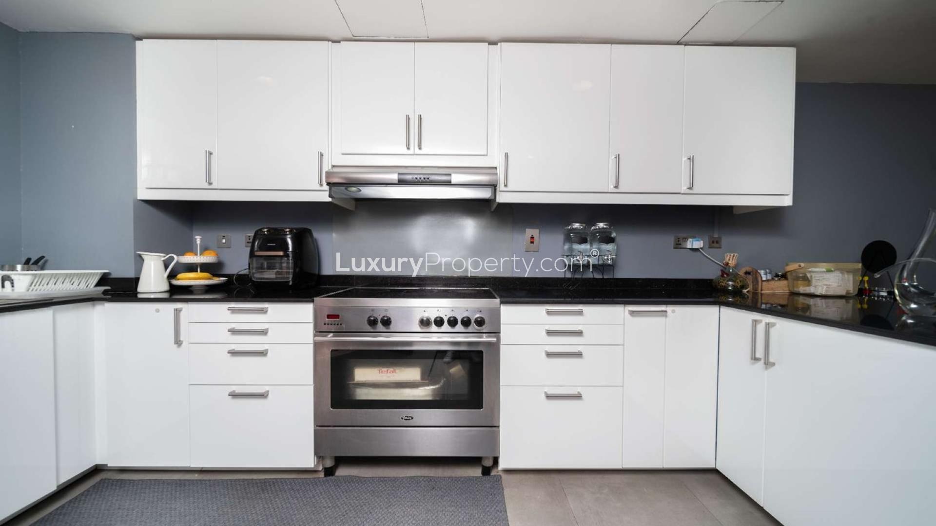 Outdoor patio of fully upgraded 4-bedroom villa in Zulal, The Lakes, for sale