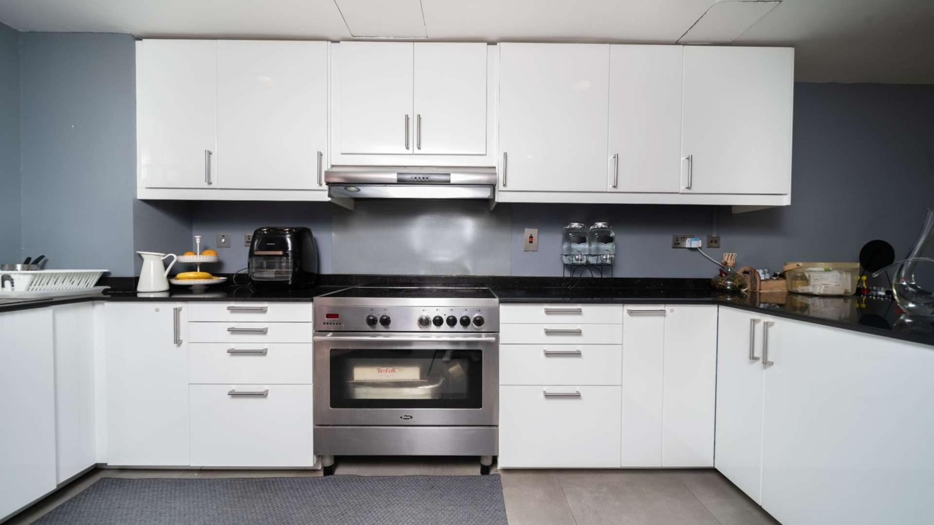 Outdoor patio of fully upgraded 4-bedroom villa in Zulal, The Lakes, for sale