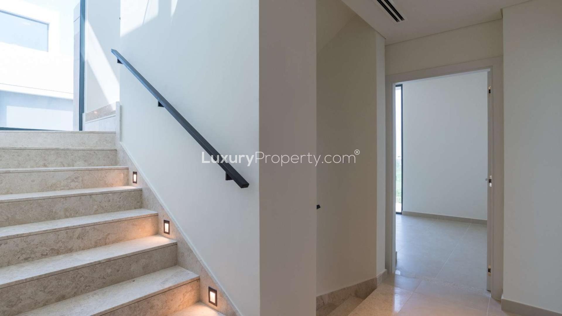 4-bedroom villa exterior in Club Villas, Dubai Hills Estate with modern architecture and palm trees