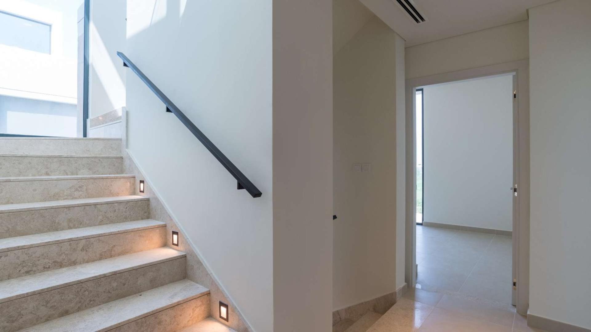 4-bedroom villa exterior in Club Villas, Dubai Hills Estate with modern architecture and palm trees