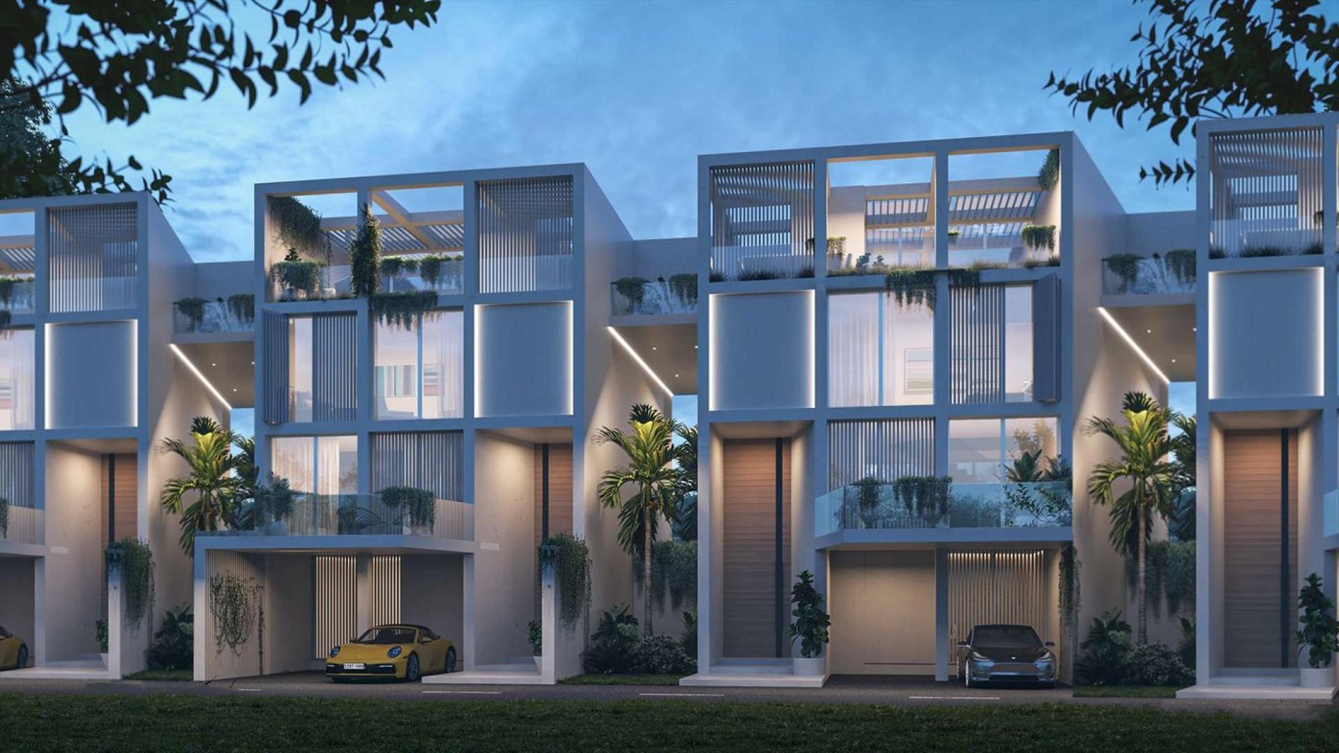 Modern 8-bedroom villa exterior in Al Barari's Ixora community, Dubai, at dusk