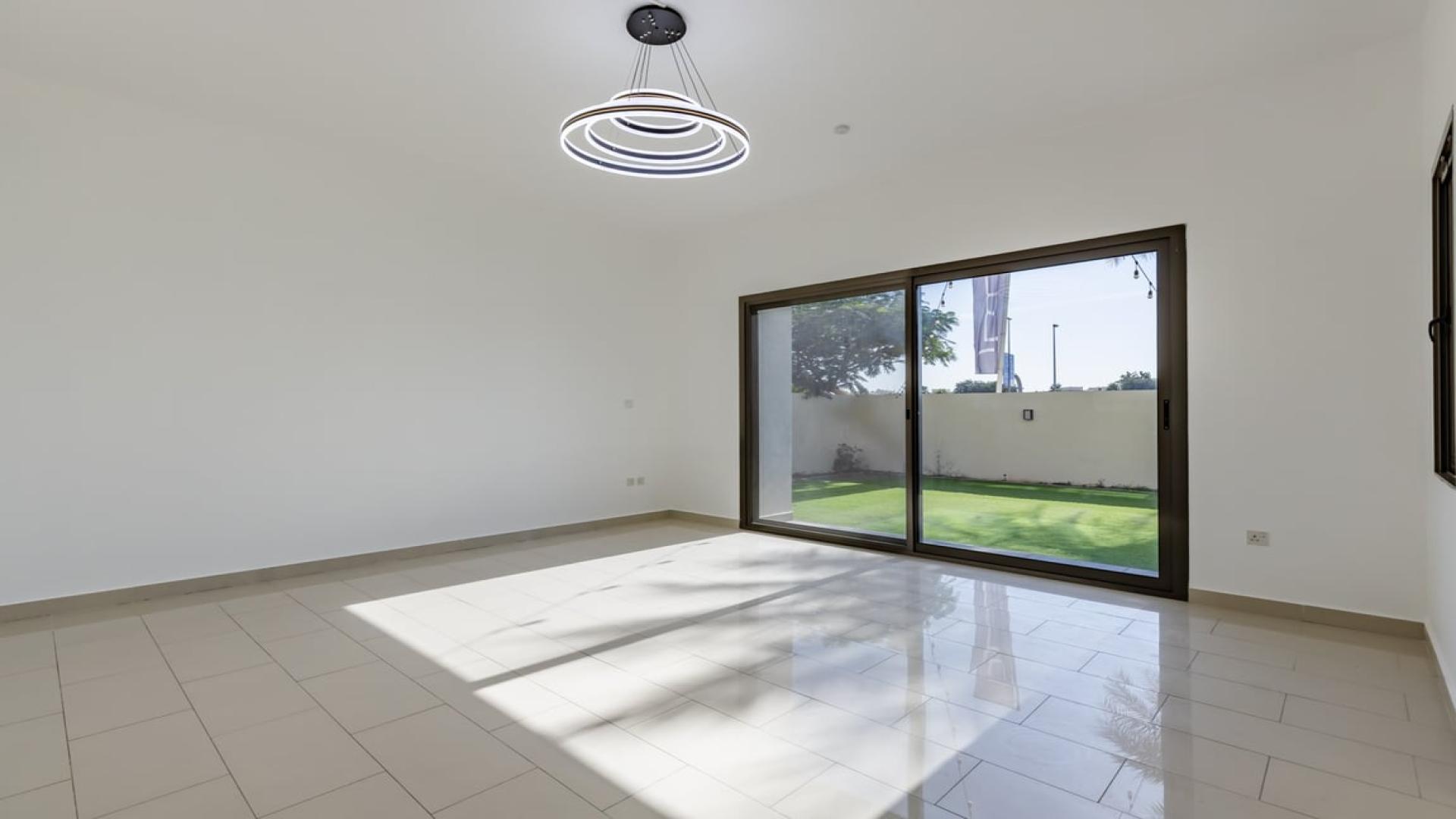 Luxury 4-bedroom villa exterior with spacious lawn in Azalea, Arabian Ranches 2, Dubai