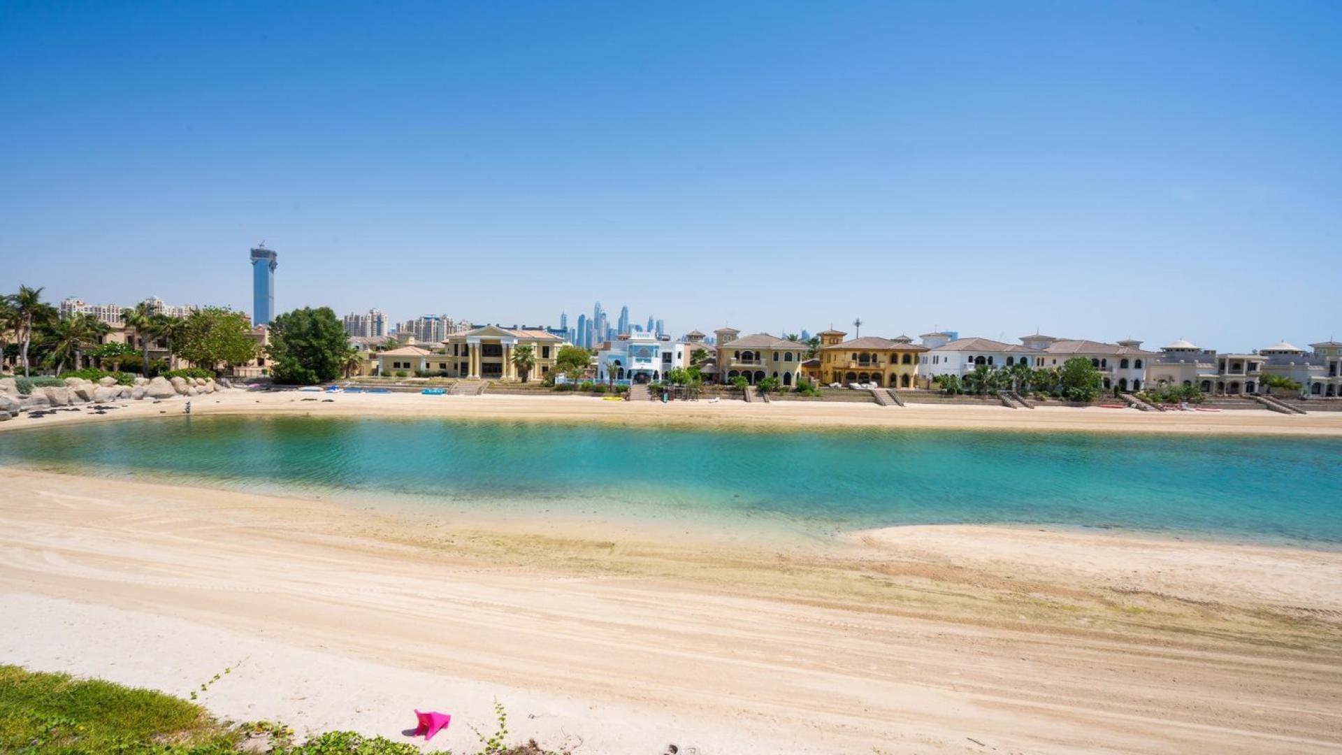 Renovated villa interior with large windows, pool view, Palm Jumeirah Garden Homes