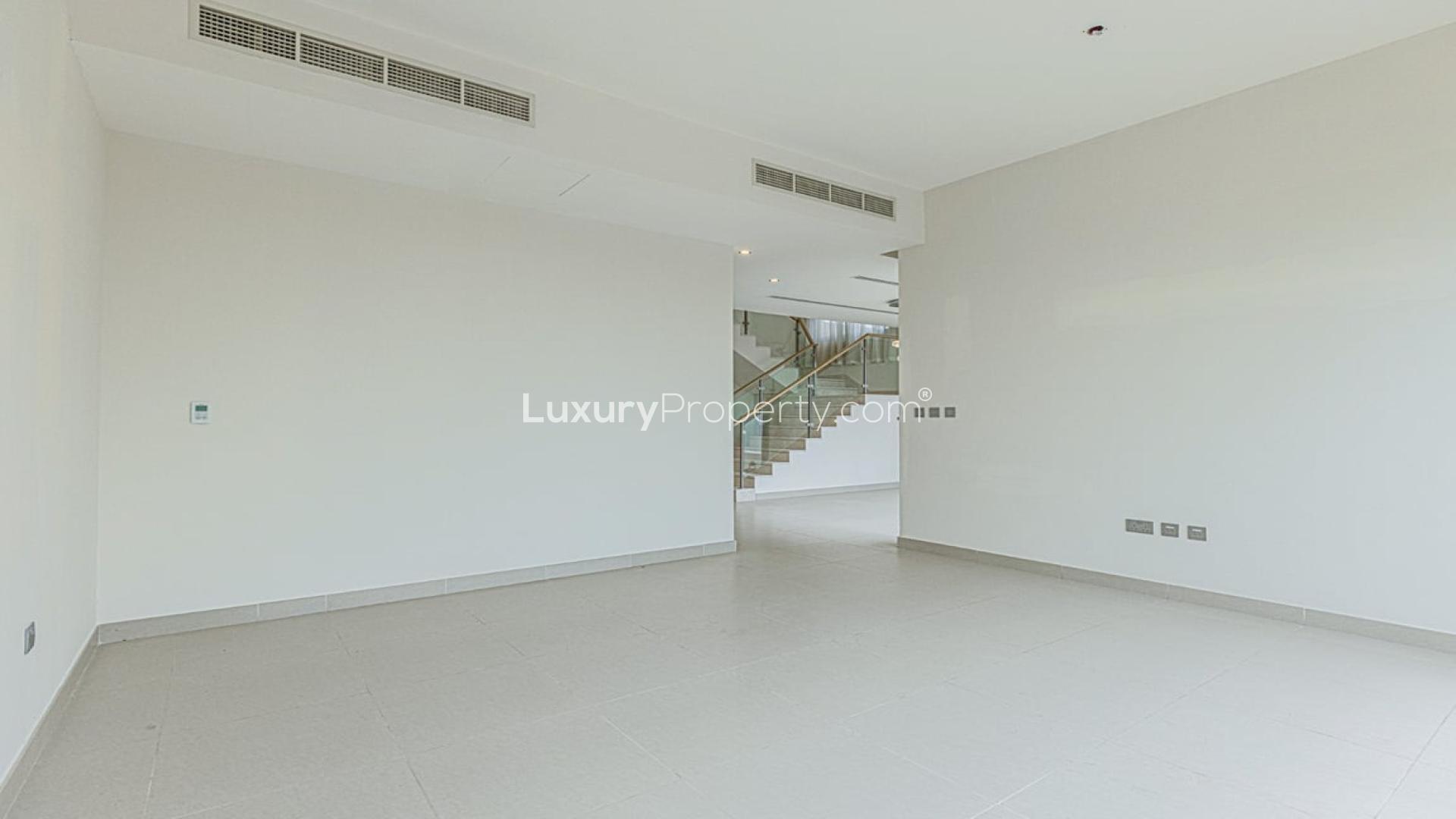 Luxurious entrance of Sidra Villas, Dubai Hills Estate, showcasing modern interior design and staircase