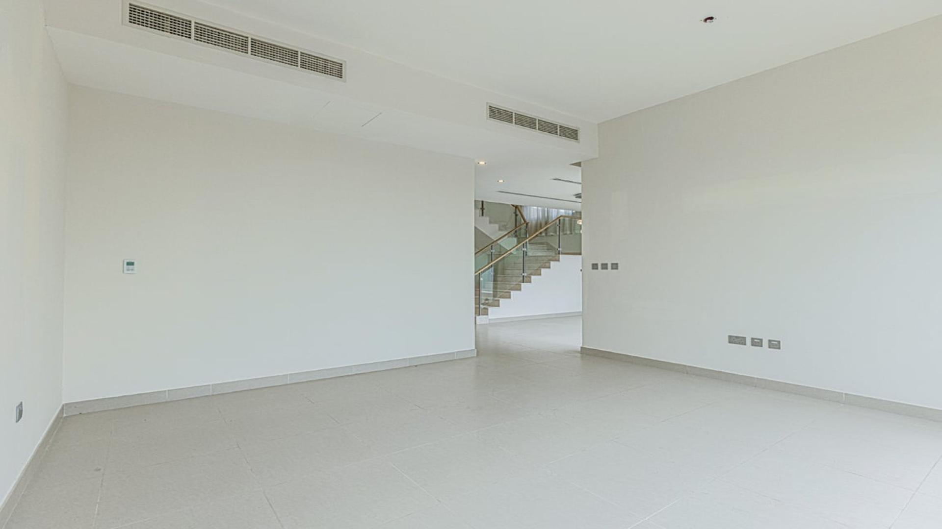 Luxurious entrance of Sidra Villas, Dubai Hills Estate, showcasing modern interior design and staircase