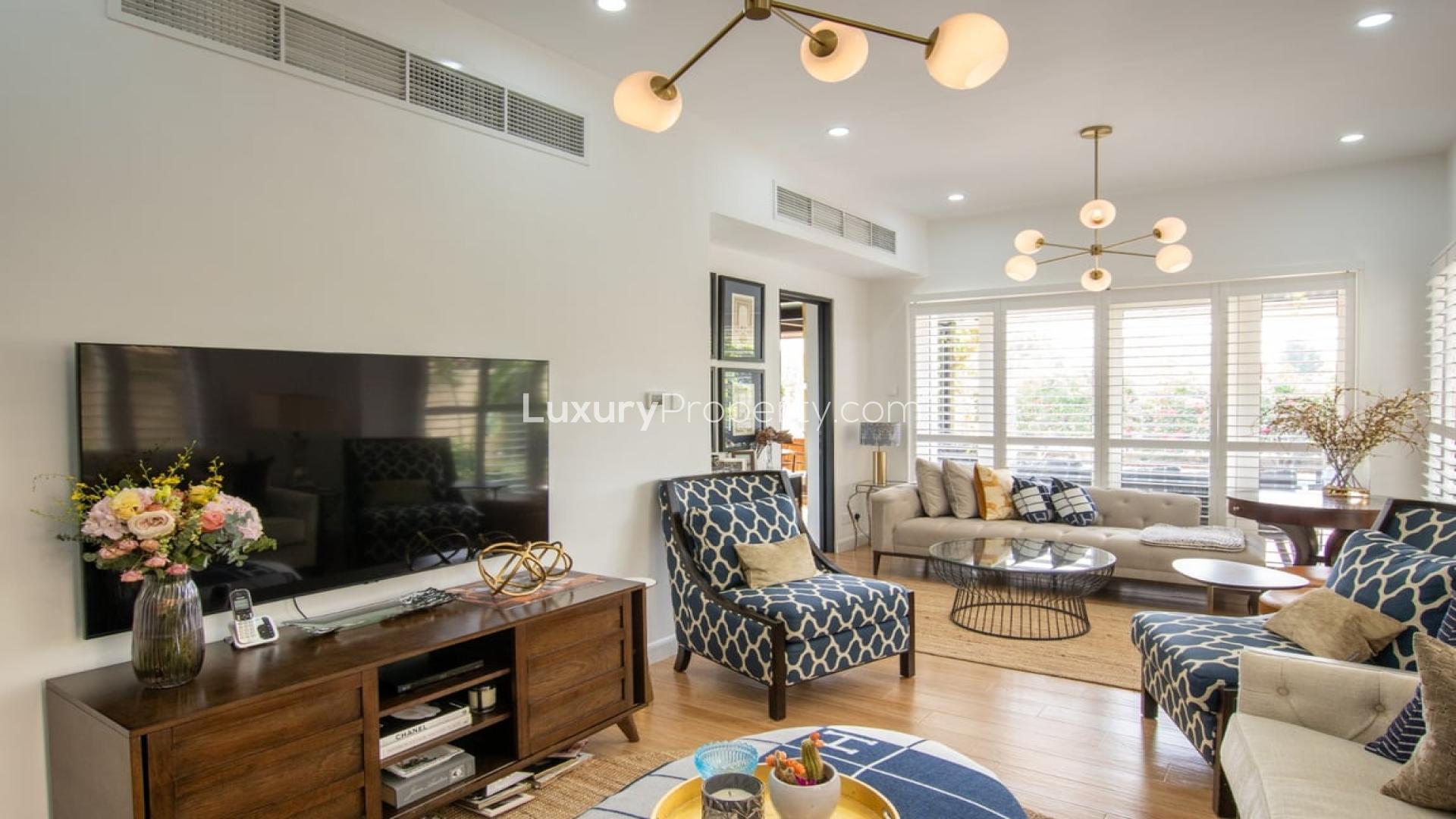 Luxurious living room in upgraded villa, Springs 7, with elegant decor and natural light