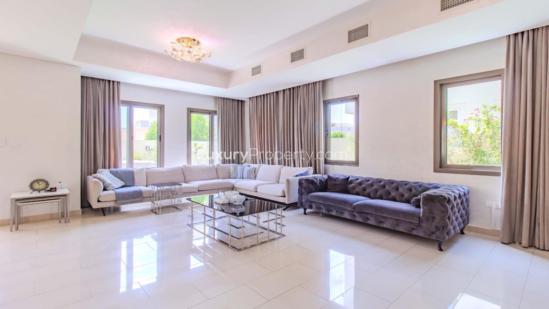 Spacious living room in upgraded Azalea villa, Arabian Ranches 2, featuring modern furnishings