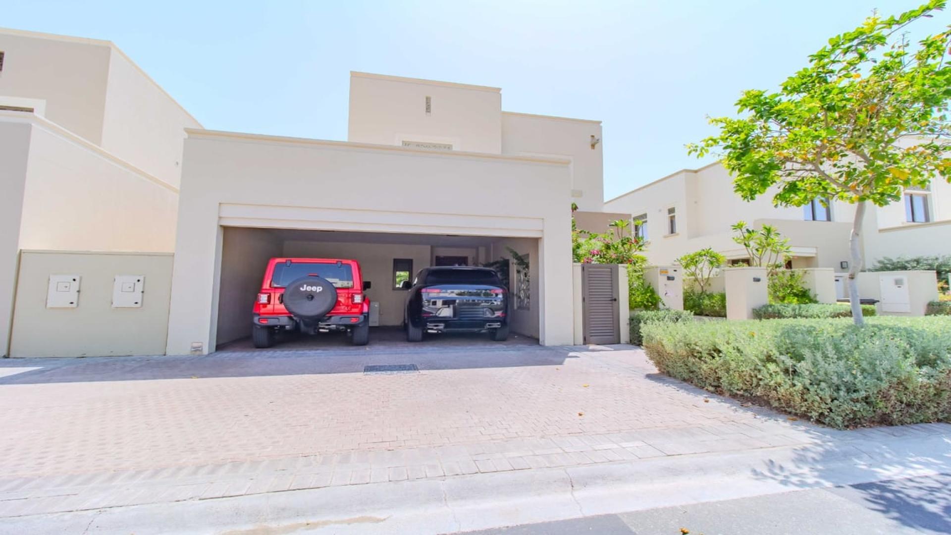Front view of a modern villa with garage in Azalea, Arabian Ranches 2