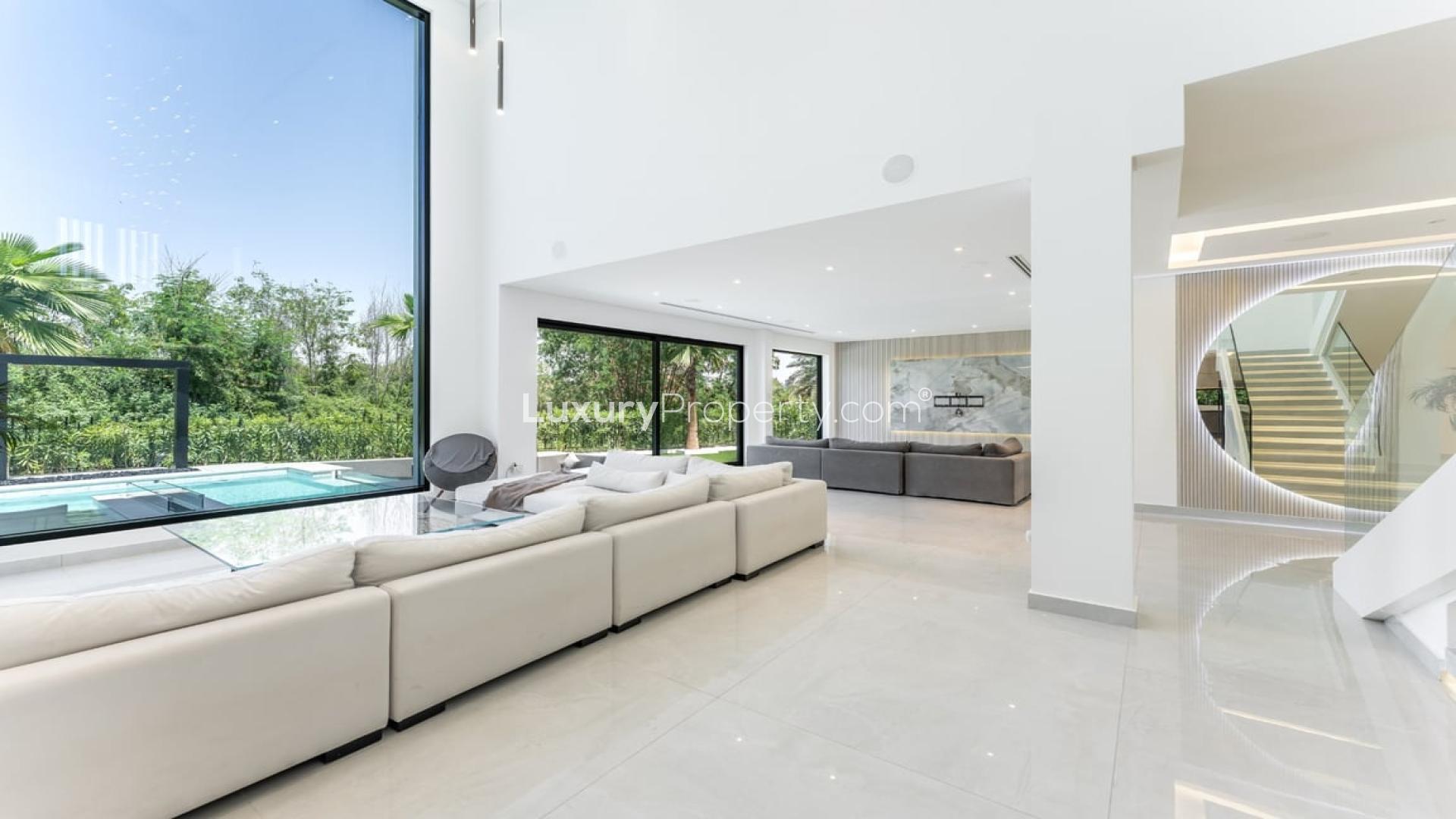 "Luxurious villa with modern pool in Jumeirah Islands, European Clusters, for sale.",Luxurious Jumeirah Islands villa interior with modern finishes, spacious living area, large windows