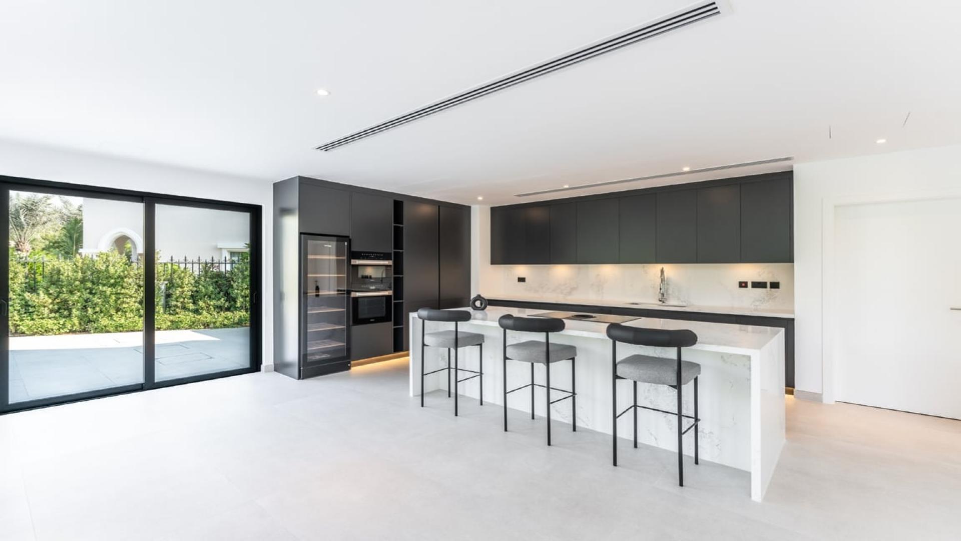 Modern kitchen in upgraded Miami-style villa, European Clusters, Jumeirah Islands