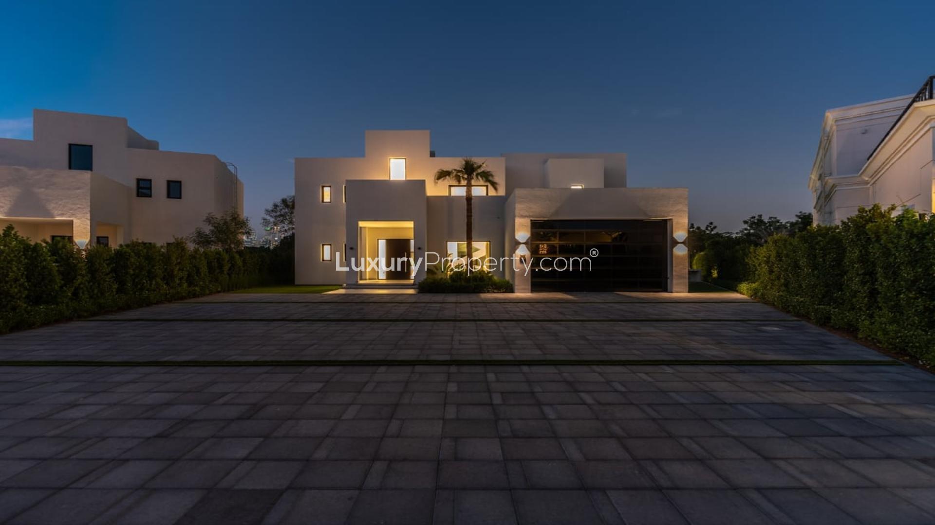 N/A,"Modern Miami-style villa exterior at night in Jumeirah Islands, European Clusters.",Modern open-plan dining and kitchen area in upgraded Miami-style villa, Jumeirah Islands