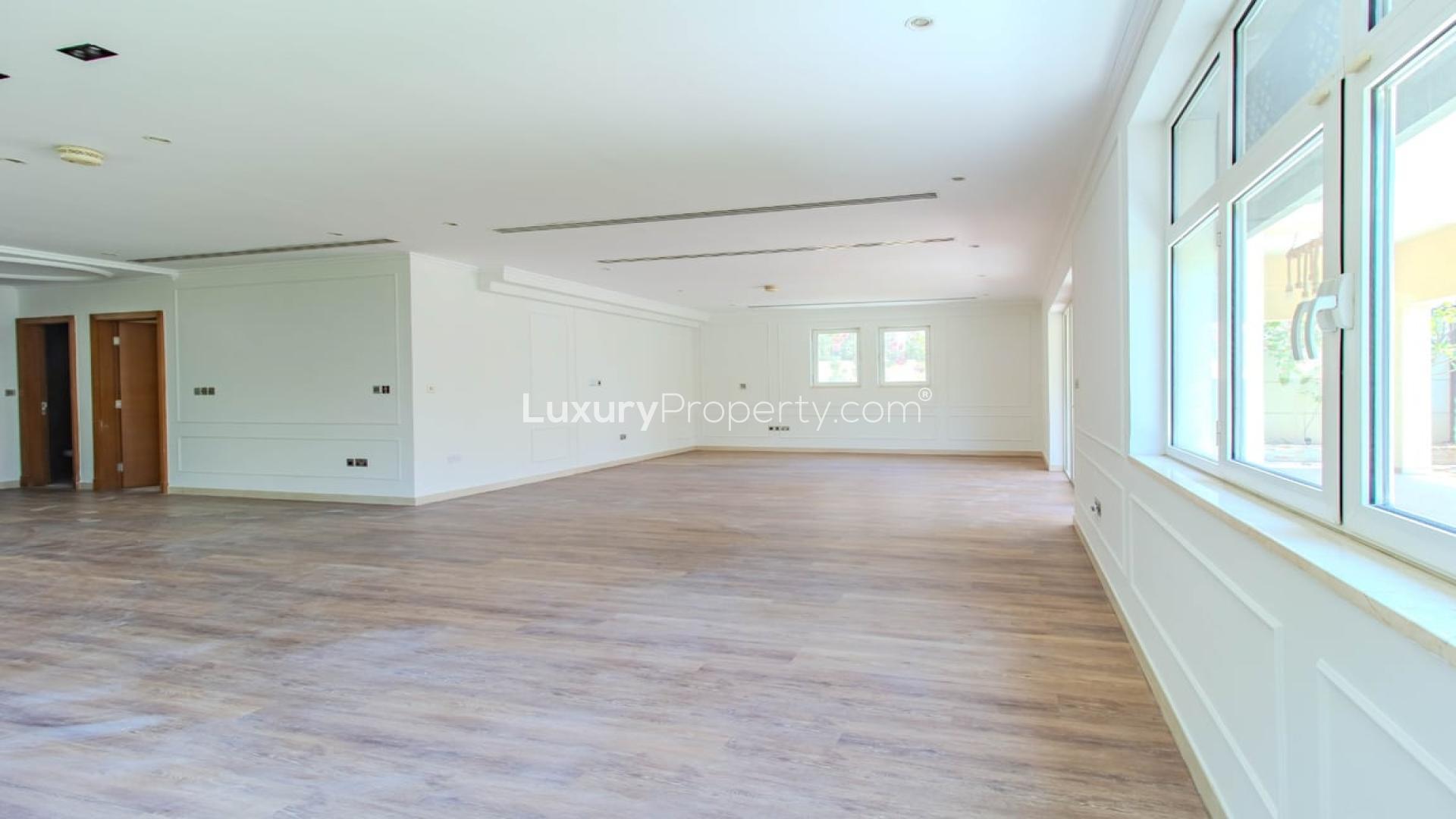 Spacious upgraded living room with garden view in Jumeirah Park Legacy villa for sale