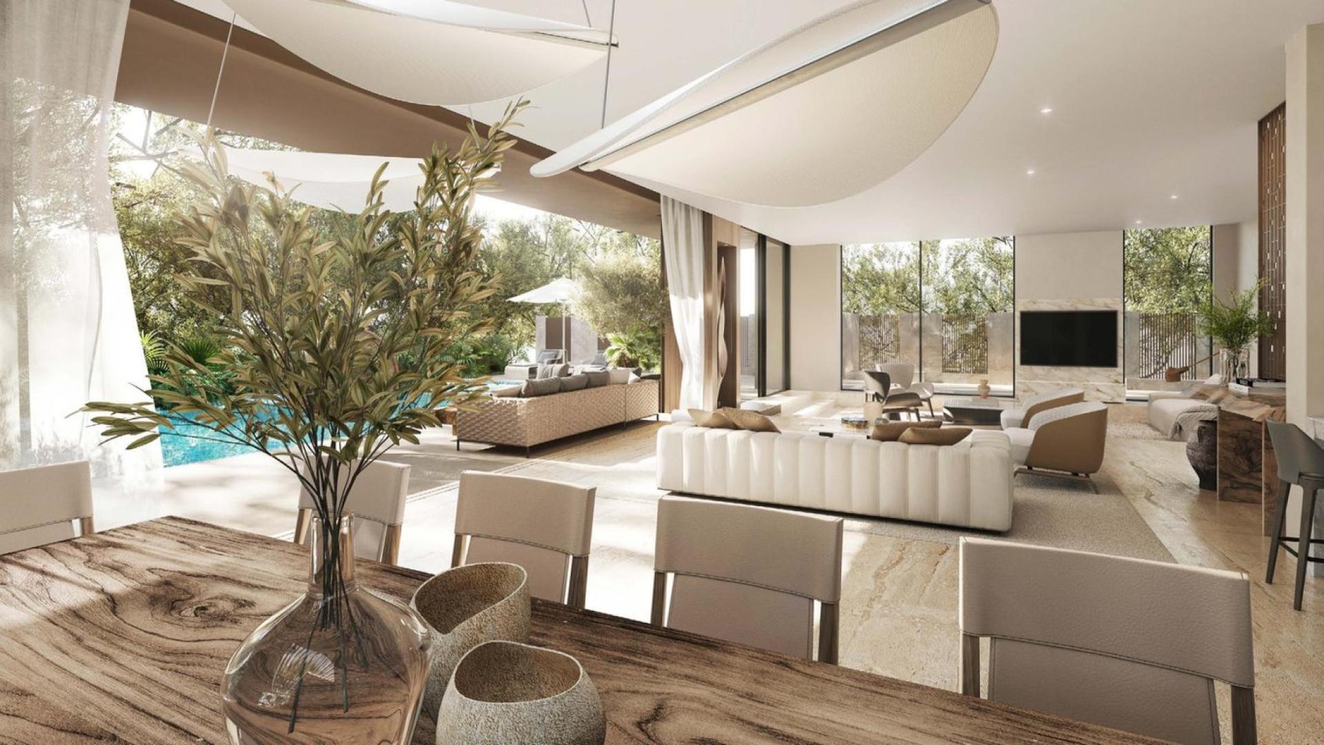 Luxurious open-plan kitchen and living area in 4-bed villa, Tilal Al Ghaf, Alaya