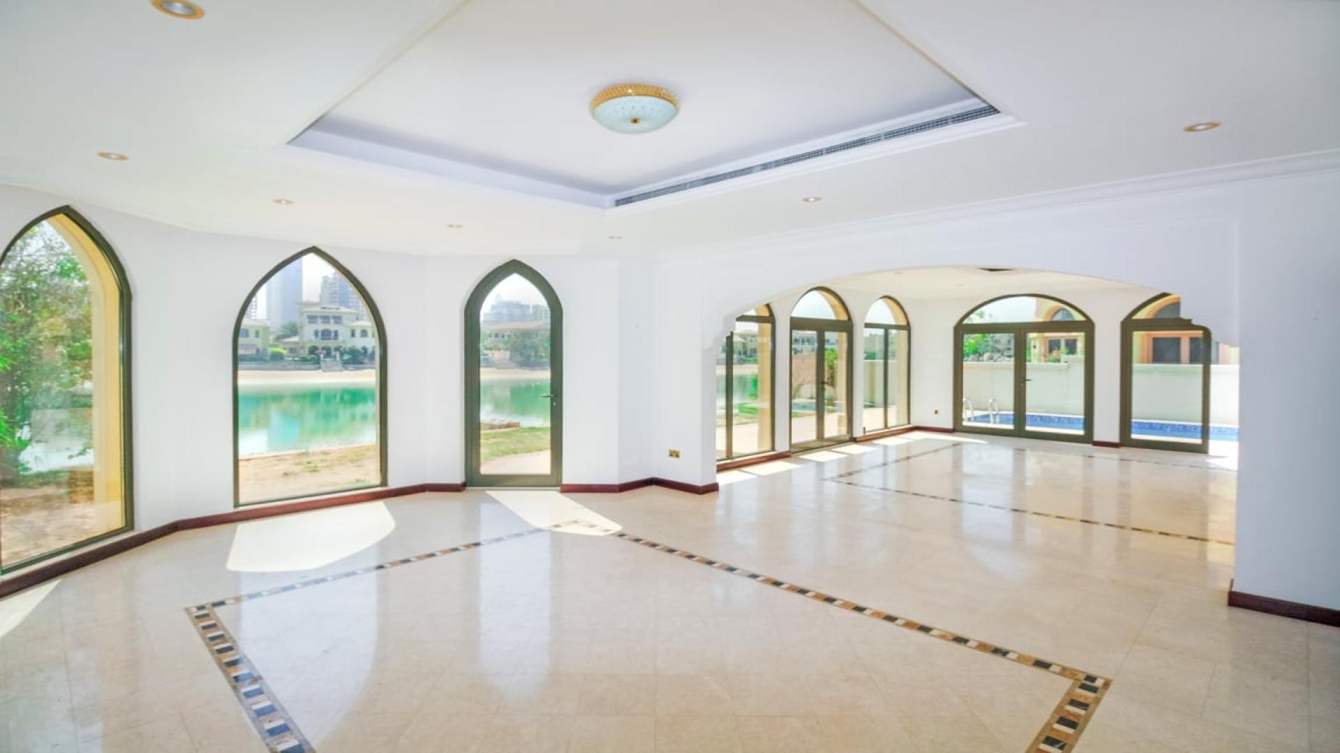 Beachfront view of Garden Home villa on Palm Jumeirah, showcasing serene waterfront scenery