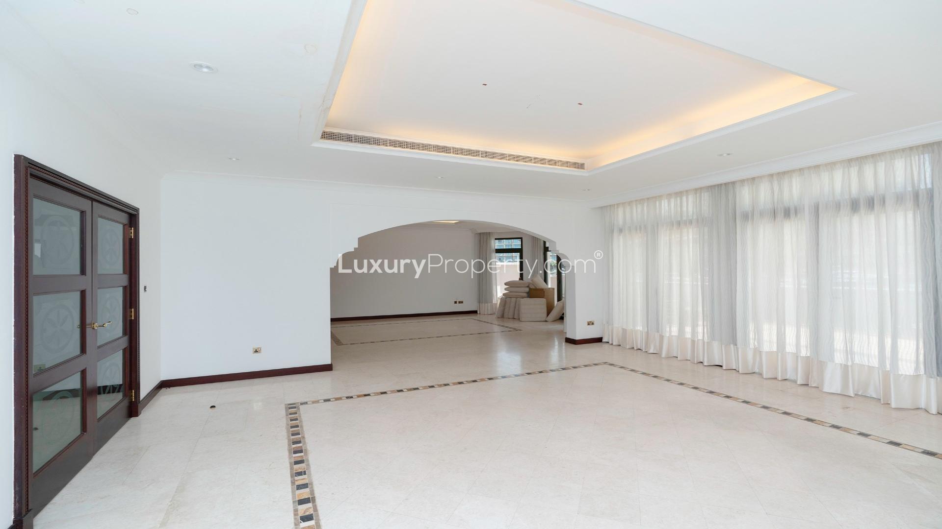 Spacious living room with elegant flooring and marina view in Palm Jumeirah villa