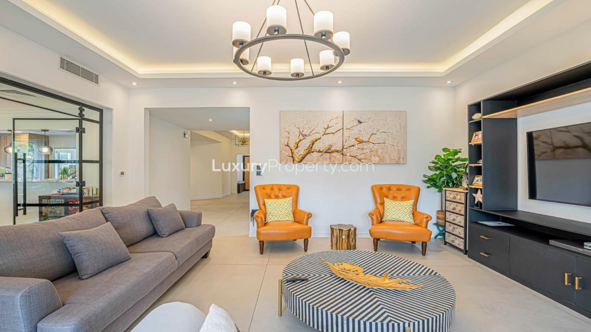 Luxury living room in Dubai Marina villa with modern decor and garden view